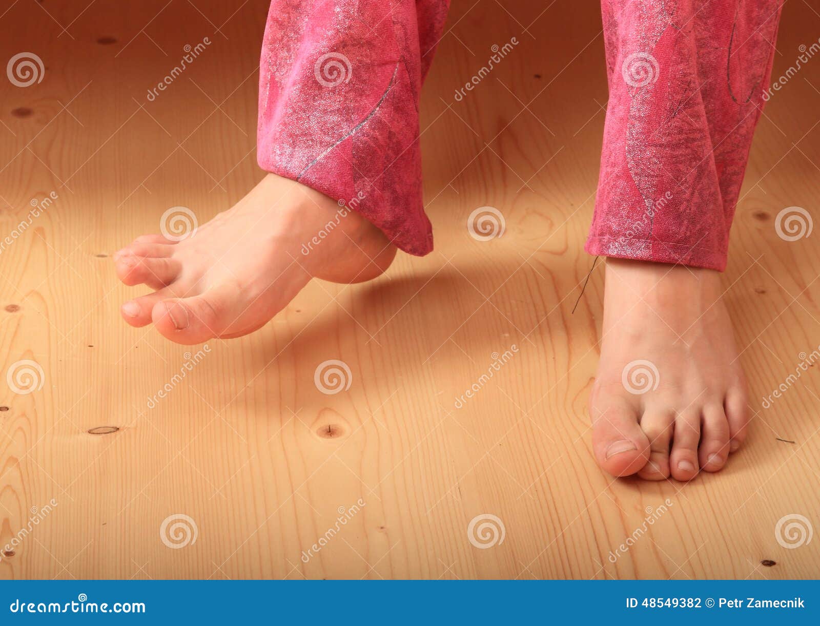 bare feet on wooden floor