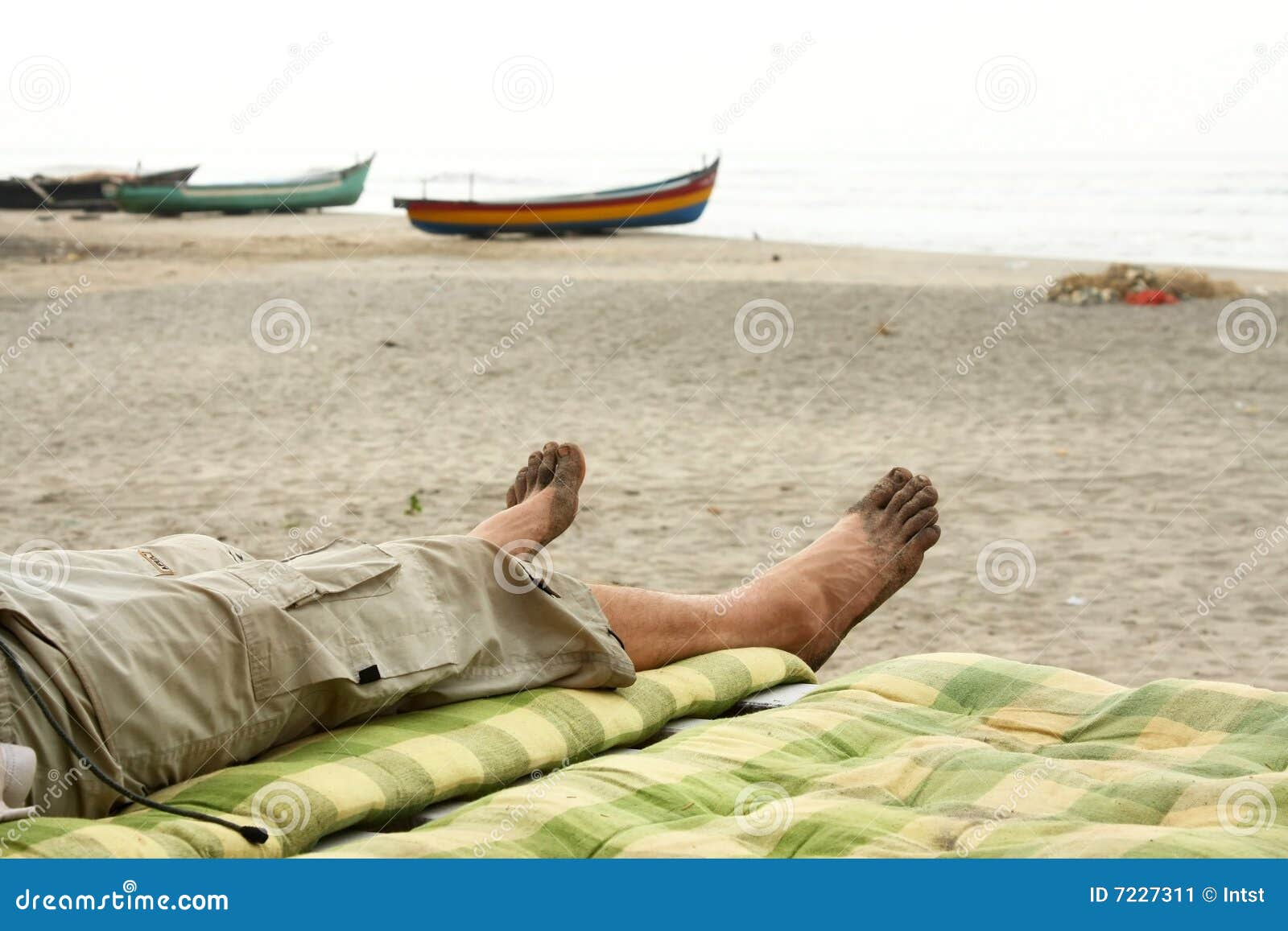 bare foots relaxing in beach