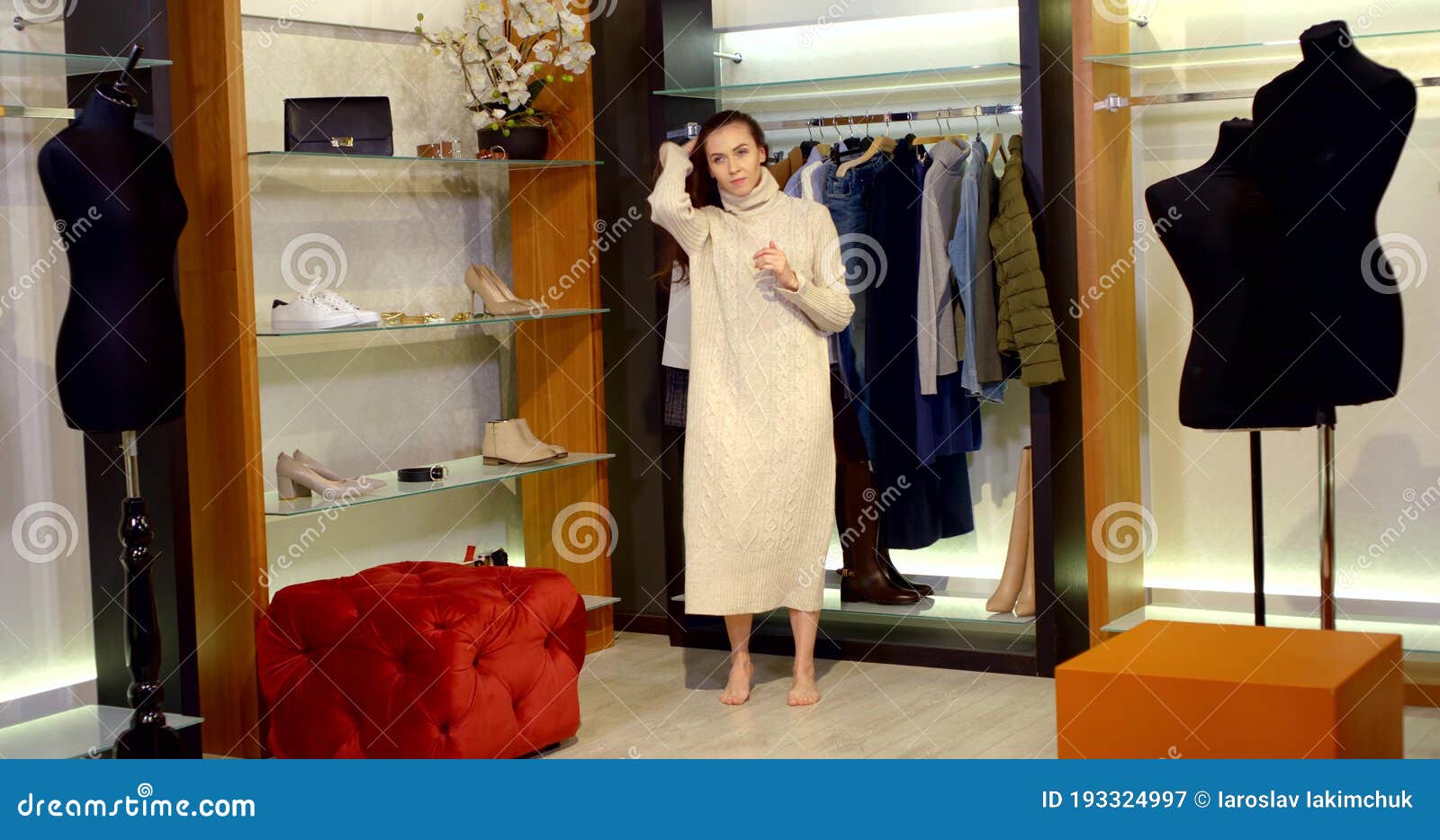 The Barefoot Brunette is in the Fitting Room. a Woman Dressed in a Long ...