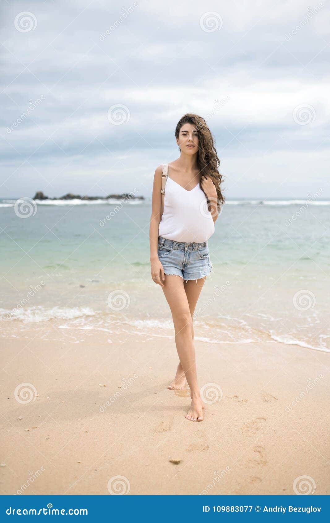 Woman Walking Rocky Beach Wet Jeans Barefoot Summer Sea Vacation Stock  Photo by ©Vera_Petrunina 564190318