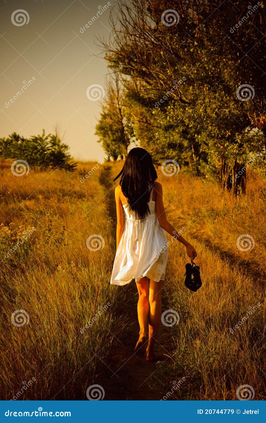 Barefoot Girl In White Dress Is On The Field Royalty Free 