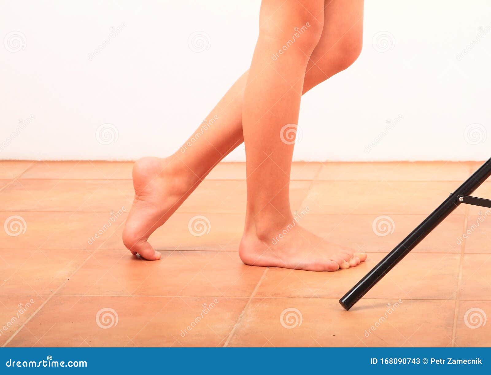 Bare Feet of a Little Girl, One Foot on Tiptoe Stock Image - Image