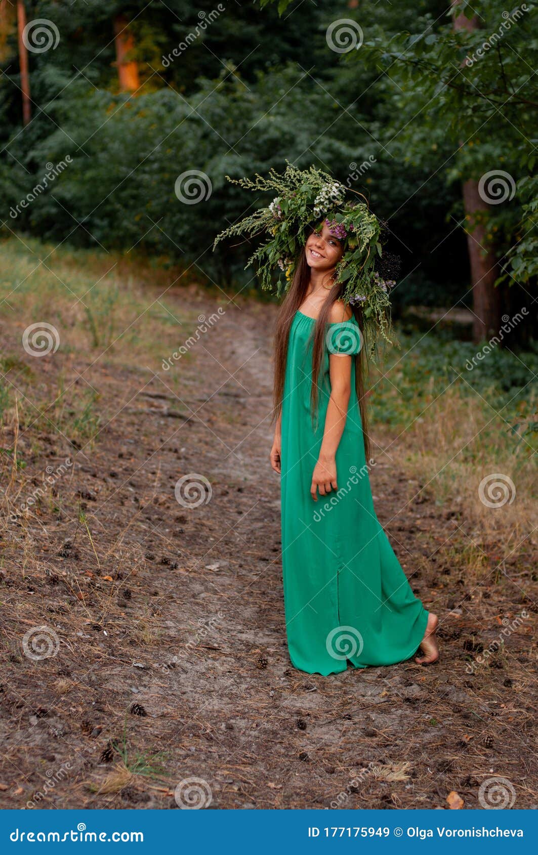 https://thumbs.dreamstime.com/z/barefoot-smiling-girl-long-green-dress-wreath-her-head-standing-forest-path-turning-half-turn-vertical-177175949.jpg