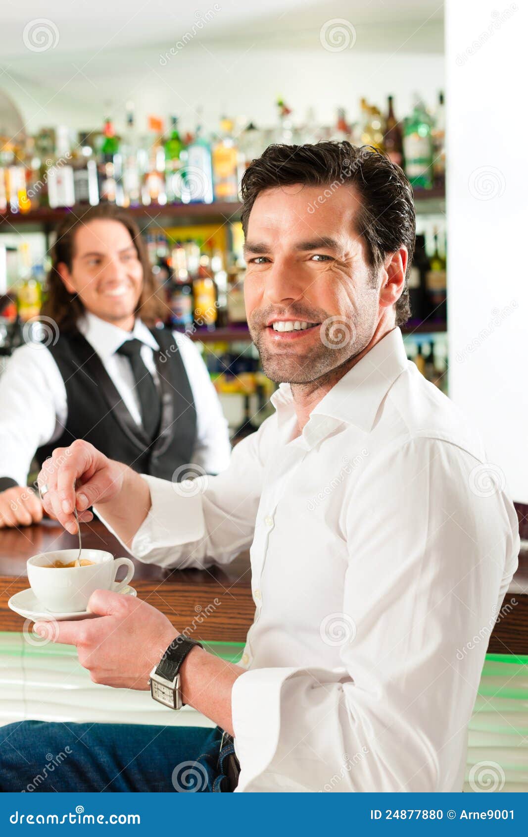 barista with client in his cafe or coffeeshop