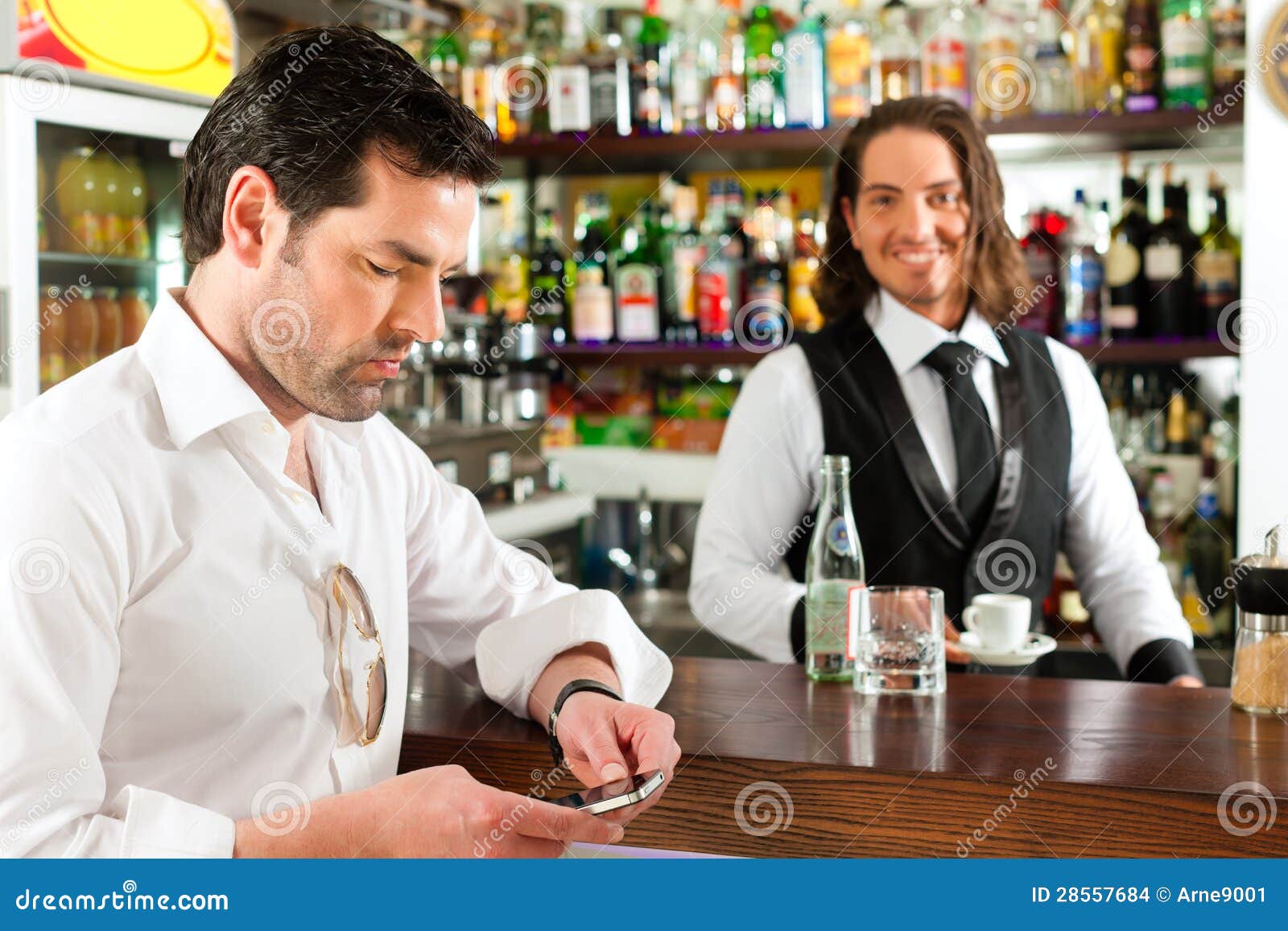 barista with client in his cafe or coffeeshop