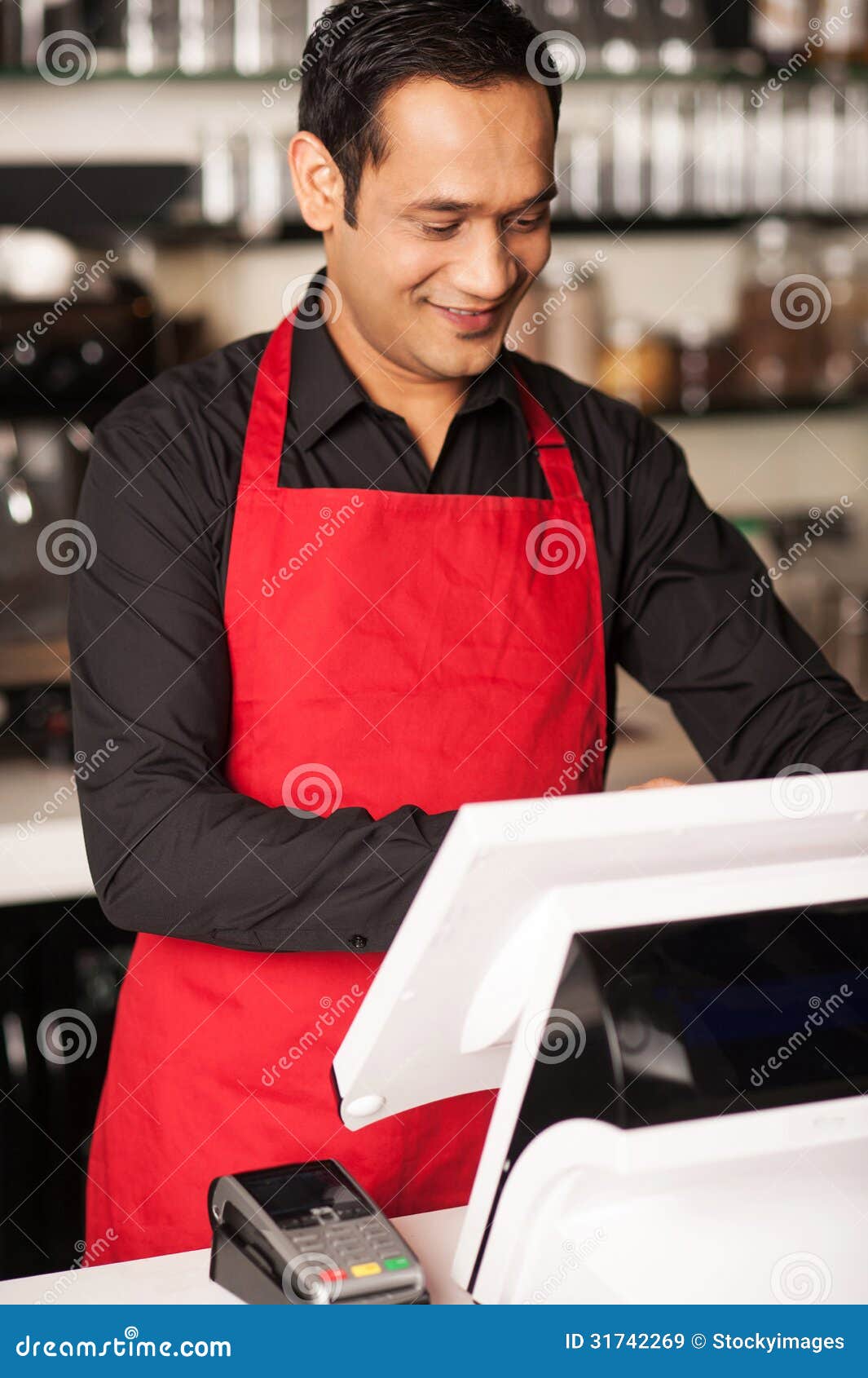 barista staff placing customers order in queue