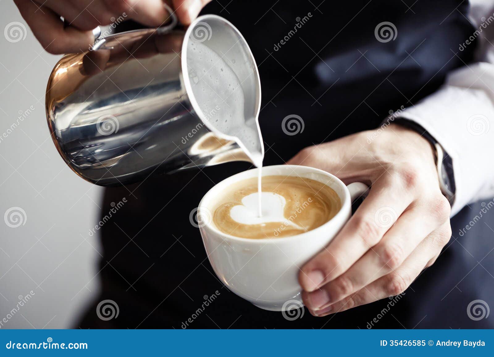 barman making coffee, pouring milk