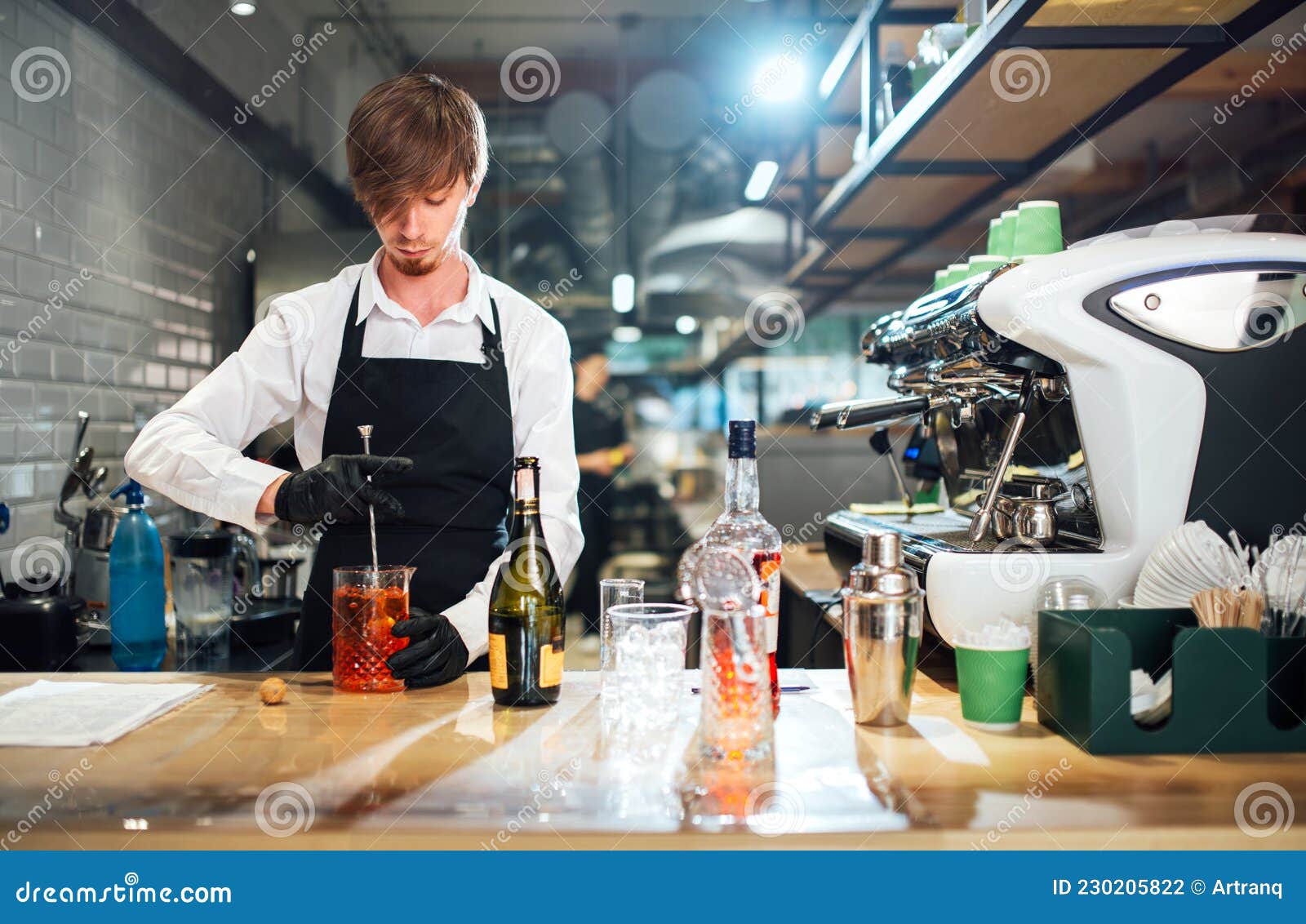 Barman Stirring the Cocktail with a Bar Spoon. Drink Preparation