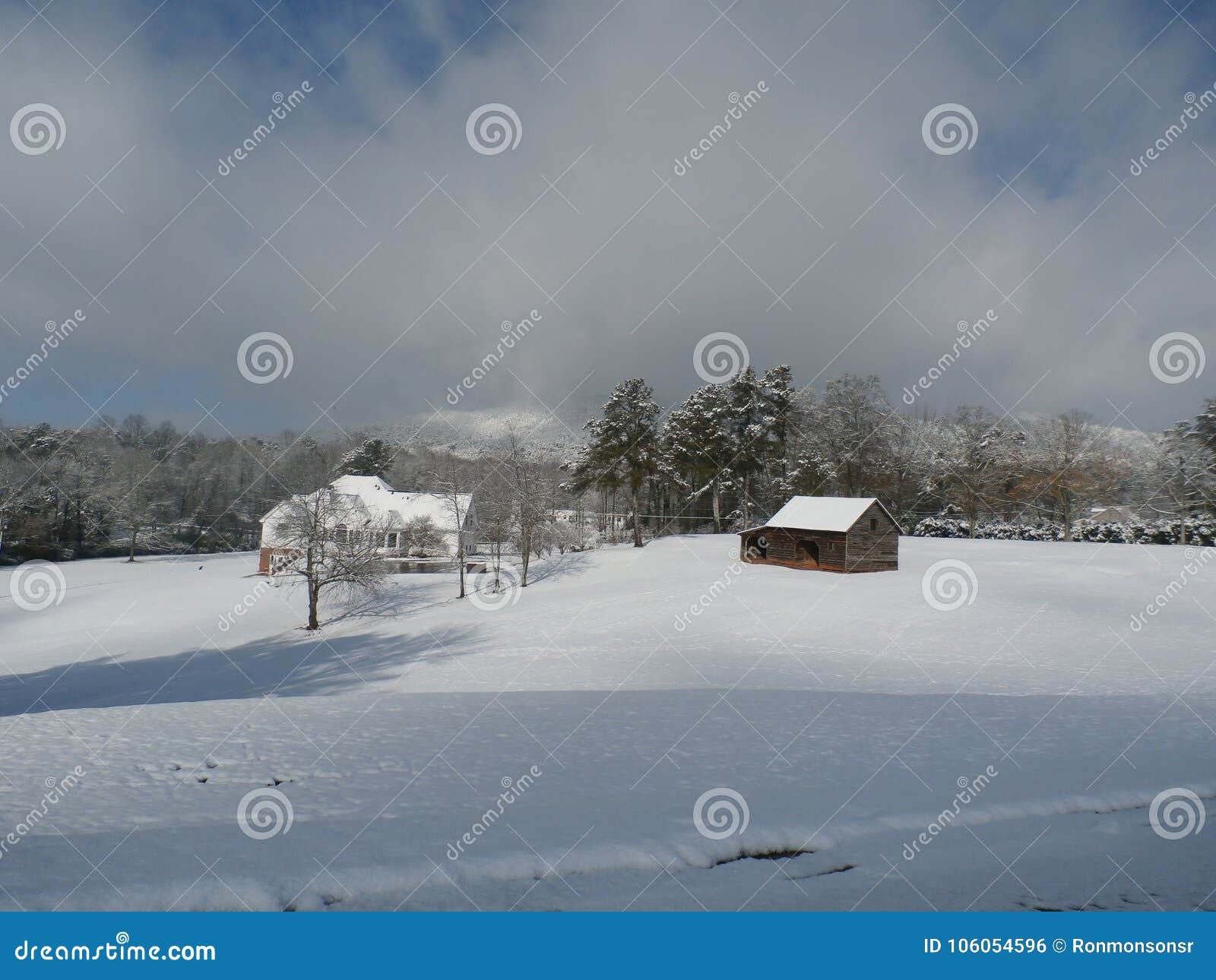 Barn in snow covered field editorial photo. Image of field 106054596