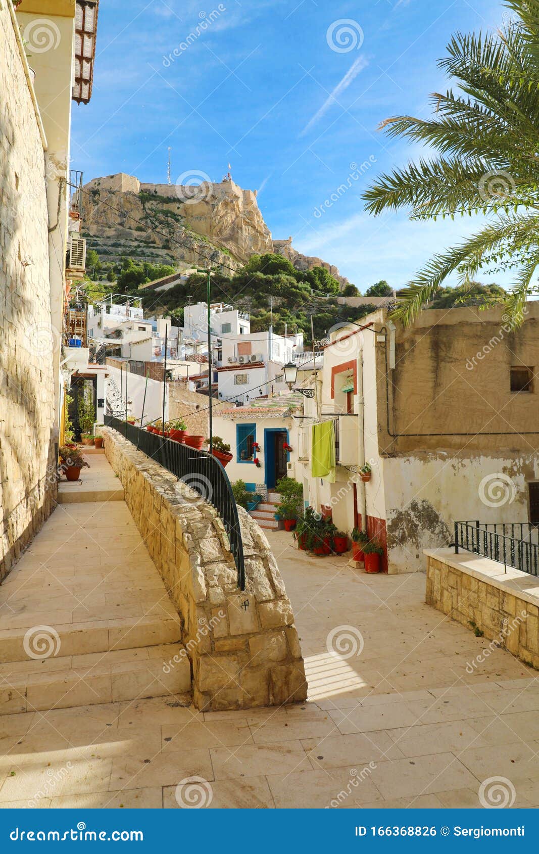 barrio santa cruz with santa barbara castle on benacantil mountain in alicante, spain