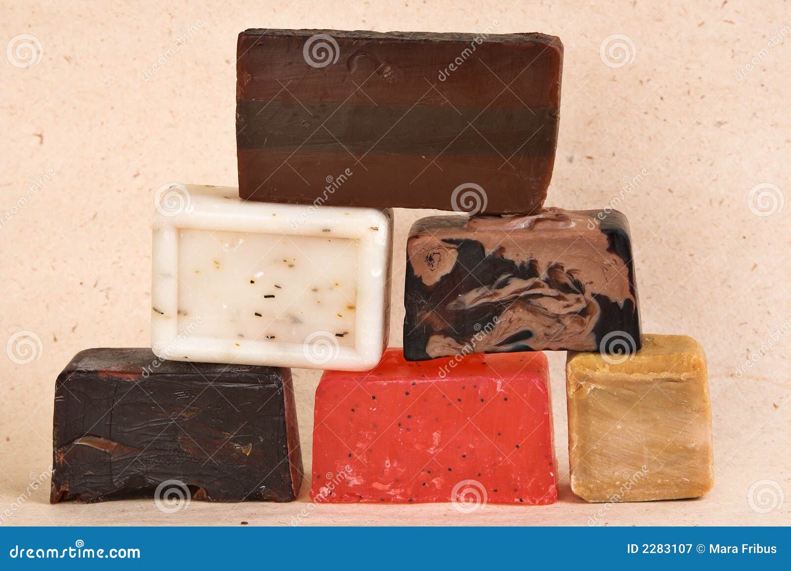 Bars of handmade soap. Bars of different colored handmade soap with herbs.