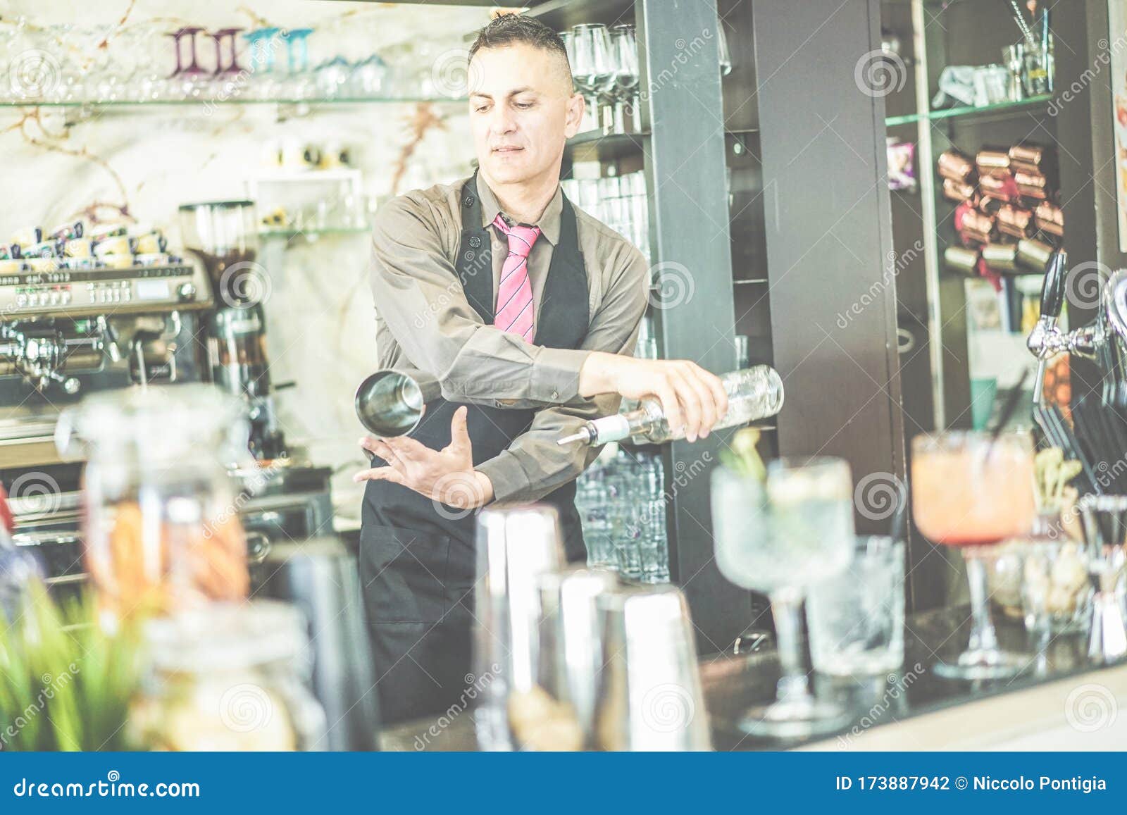 Bartender Doing Flair Inside Cruise American Bar - Barman at Work  Performing Freestyle with Bottle and Shaker - Focus on Man Face Stock Photo  - Image of ibiza, lifestyle: 173887942