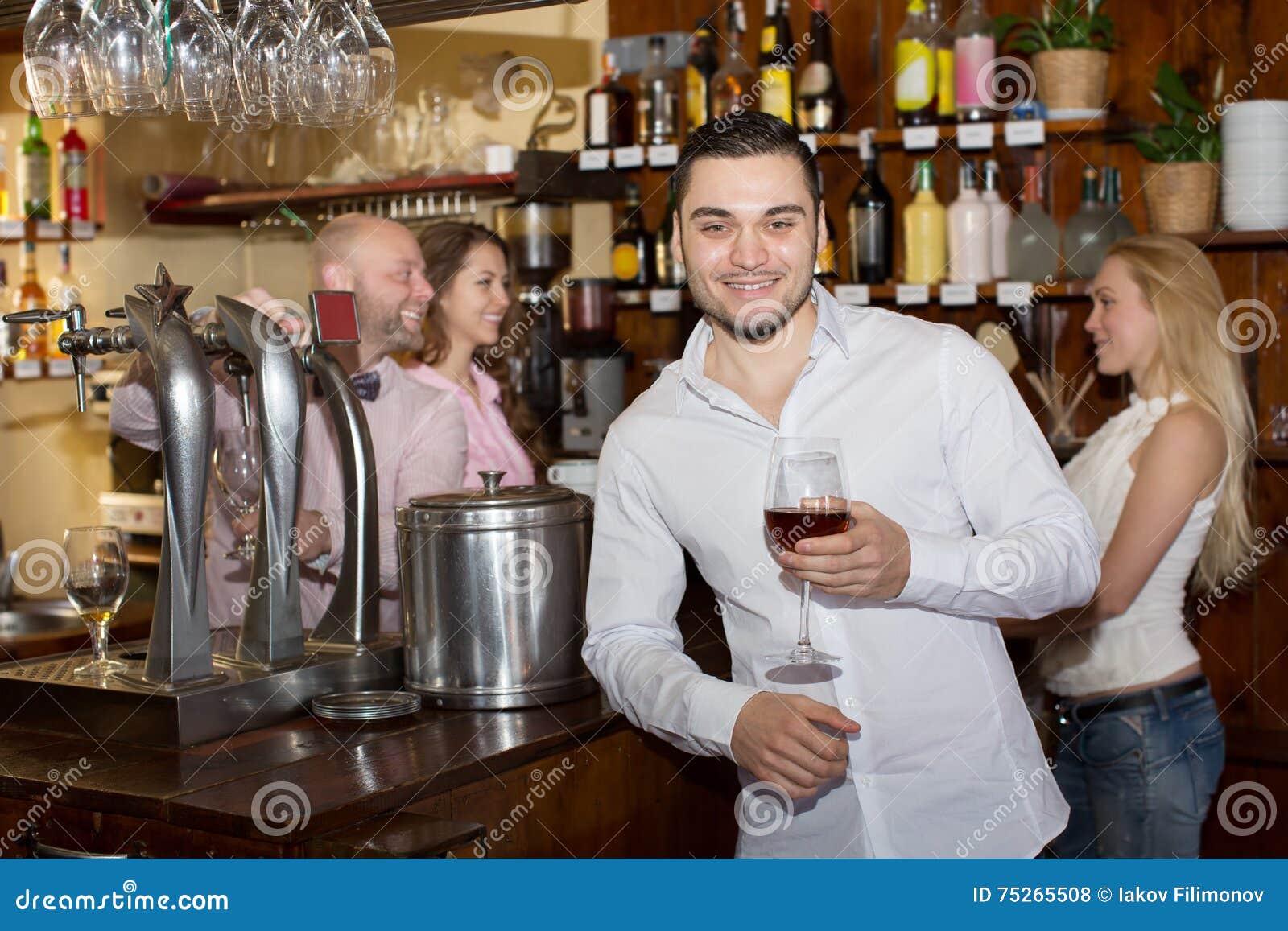 Bartender Entertaining Guests Stock Photo Image of counter, faces 75265508