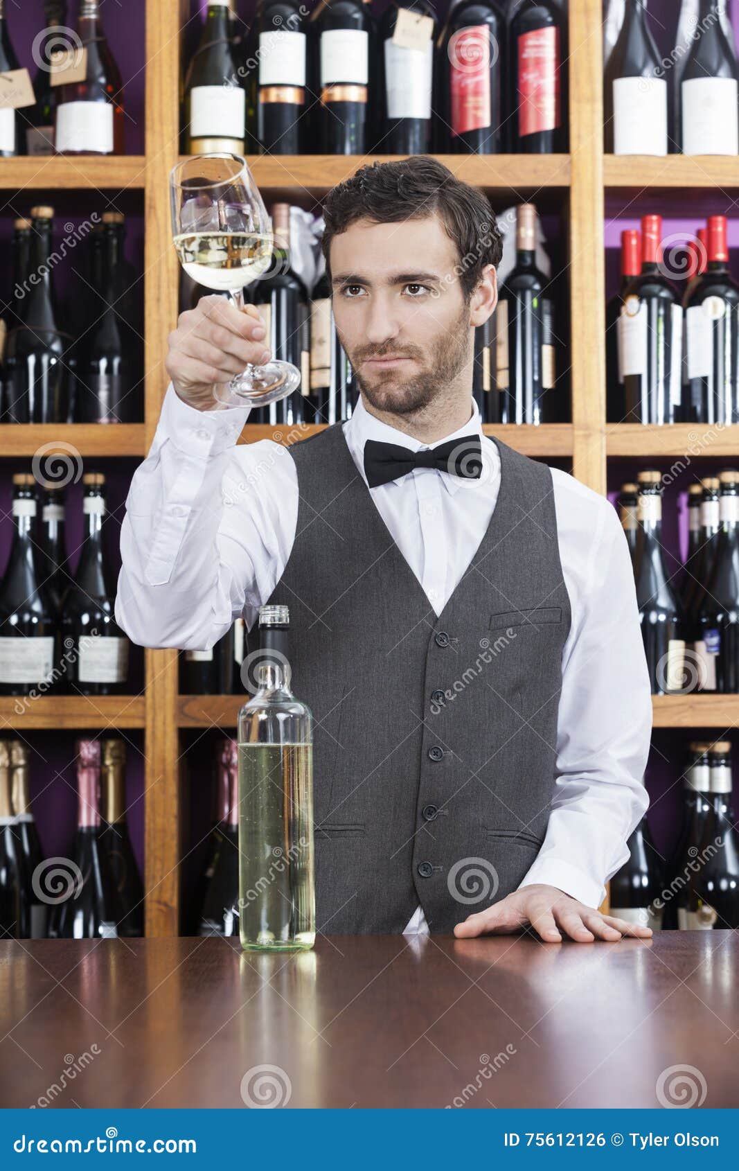 Bartender Examining White Wine in Glass at Shop Stock Photo Image of