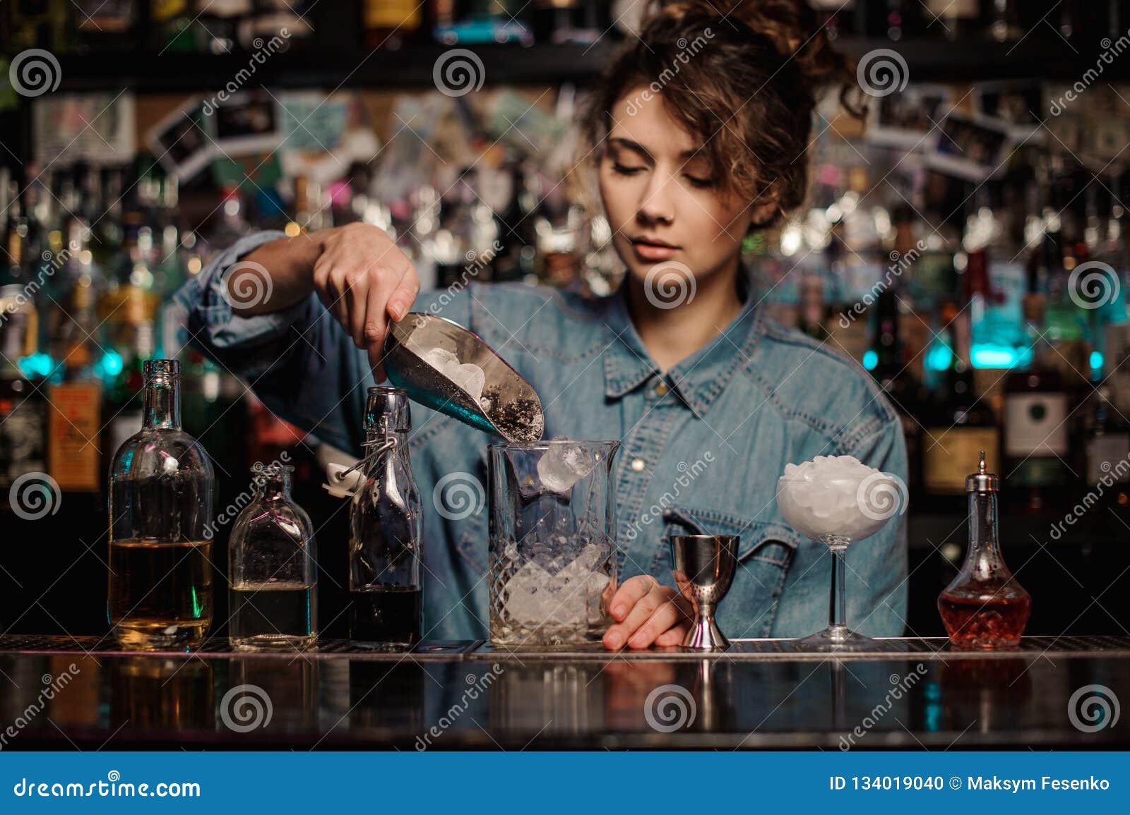 Bartender Girl Adding To the Measuring Glass Cup an Ice Cubes Stock ...