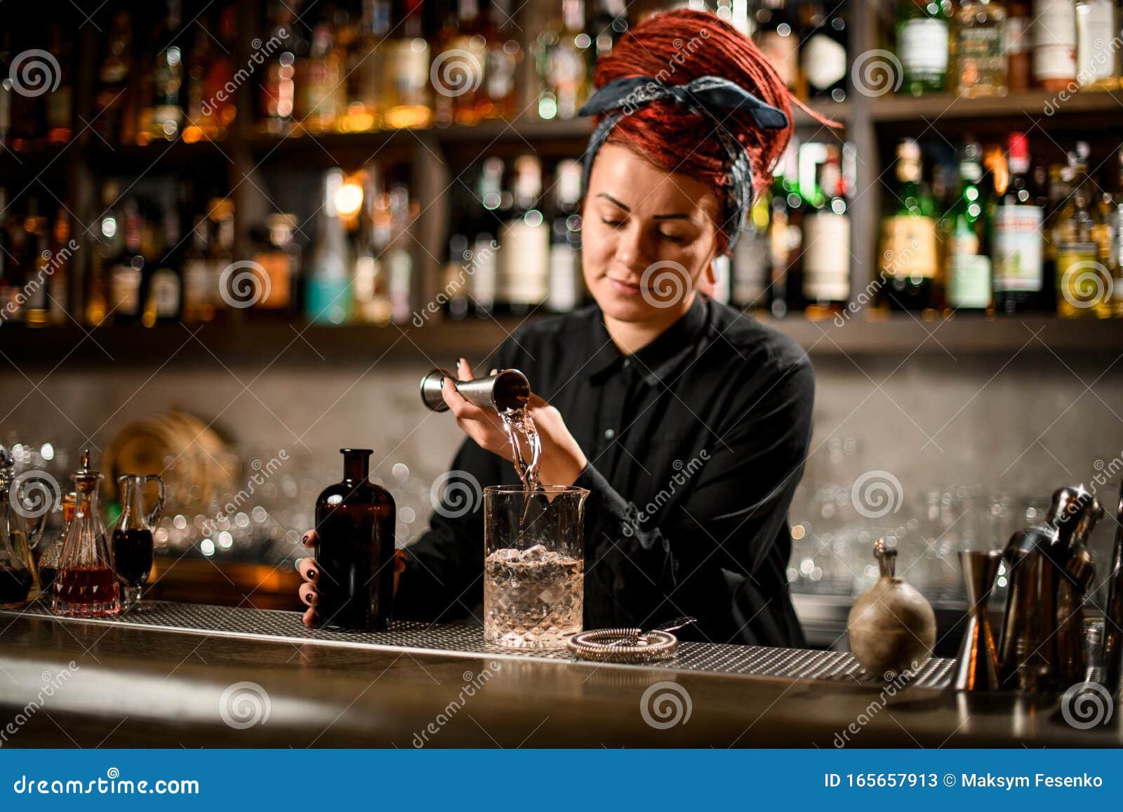 Bartender Girl with a Red Hair Pouring a Alcoholic Drink from the ...