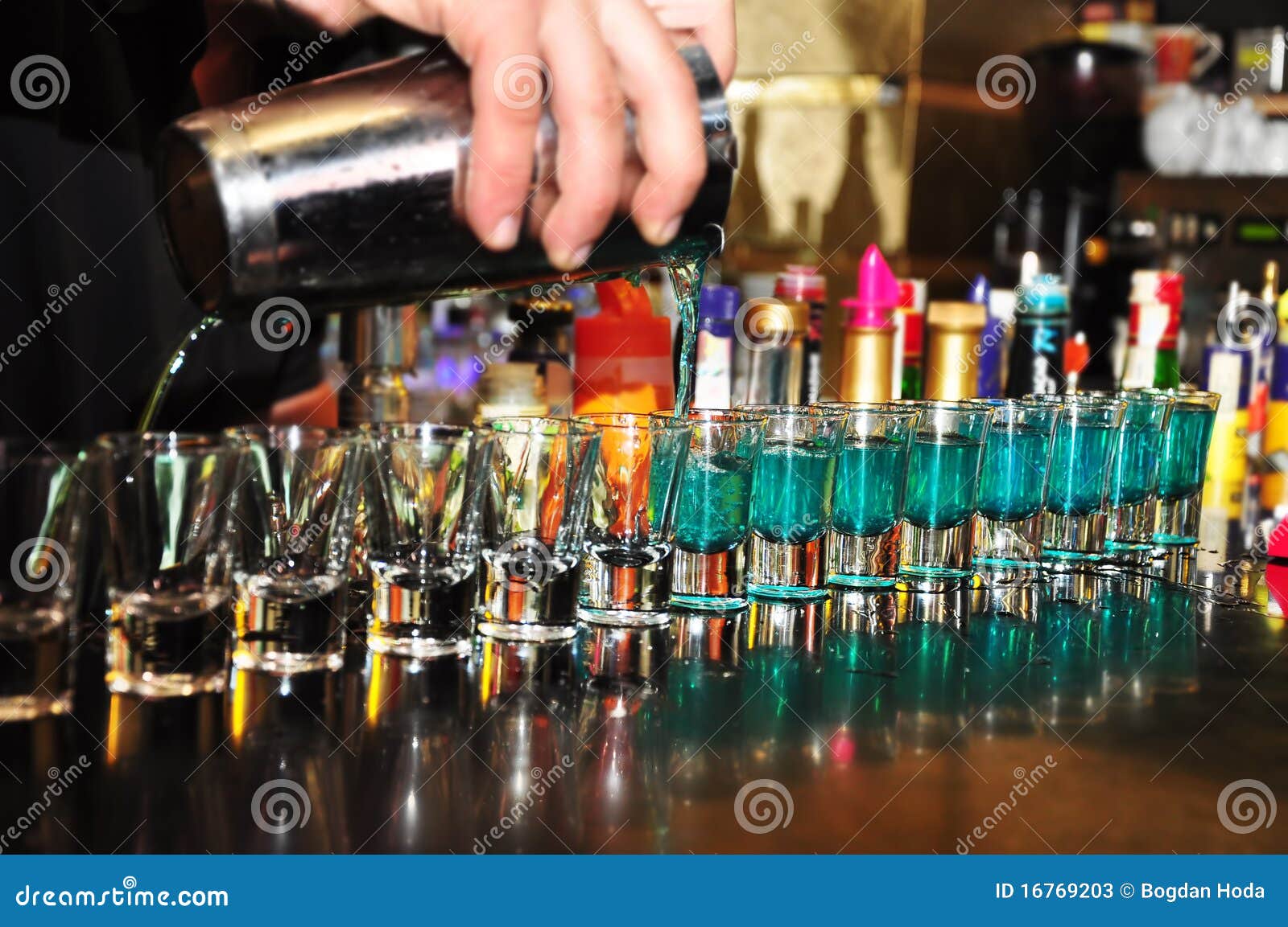 bartender pouring alcoholic drink