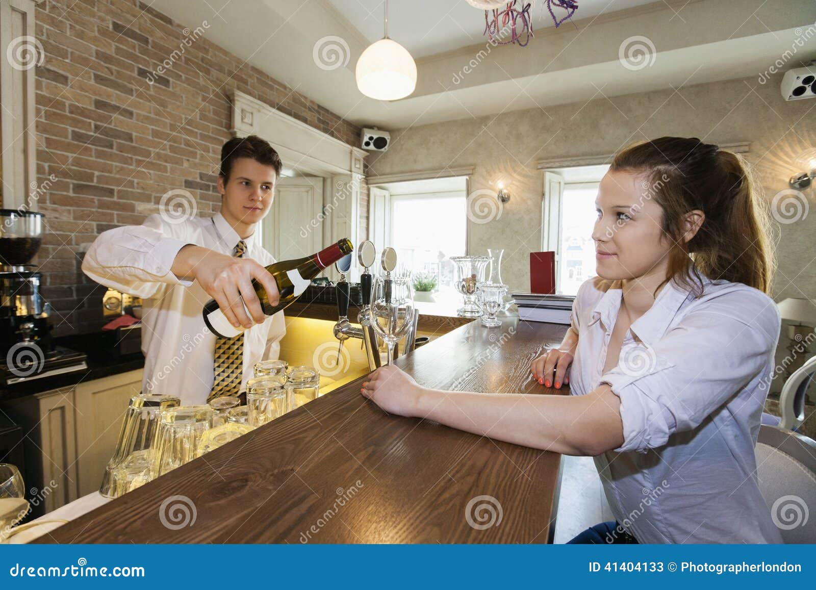 Bartender Pouring Wine for Female Customer at Restaurant Counter Stock Image Image of pouring