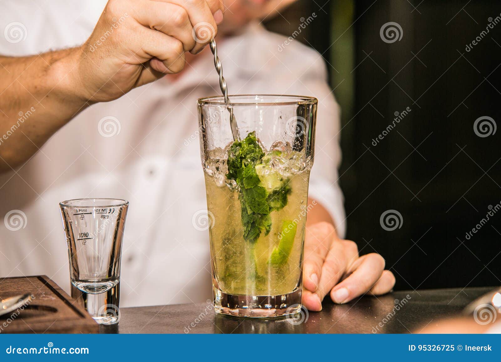 Bartender Preparing Mojito Cocktail Drink at the Bar Stock Image