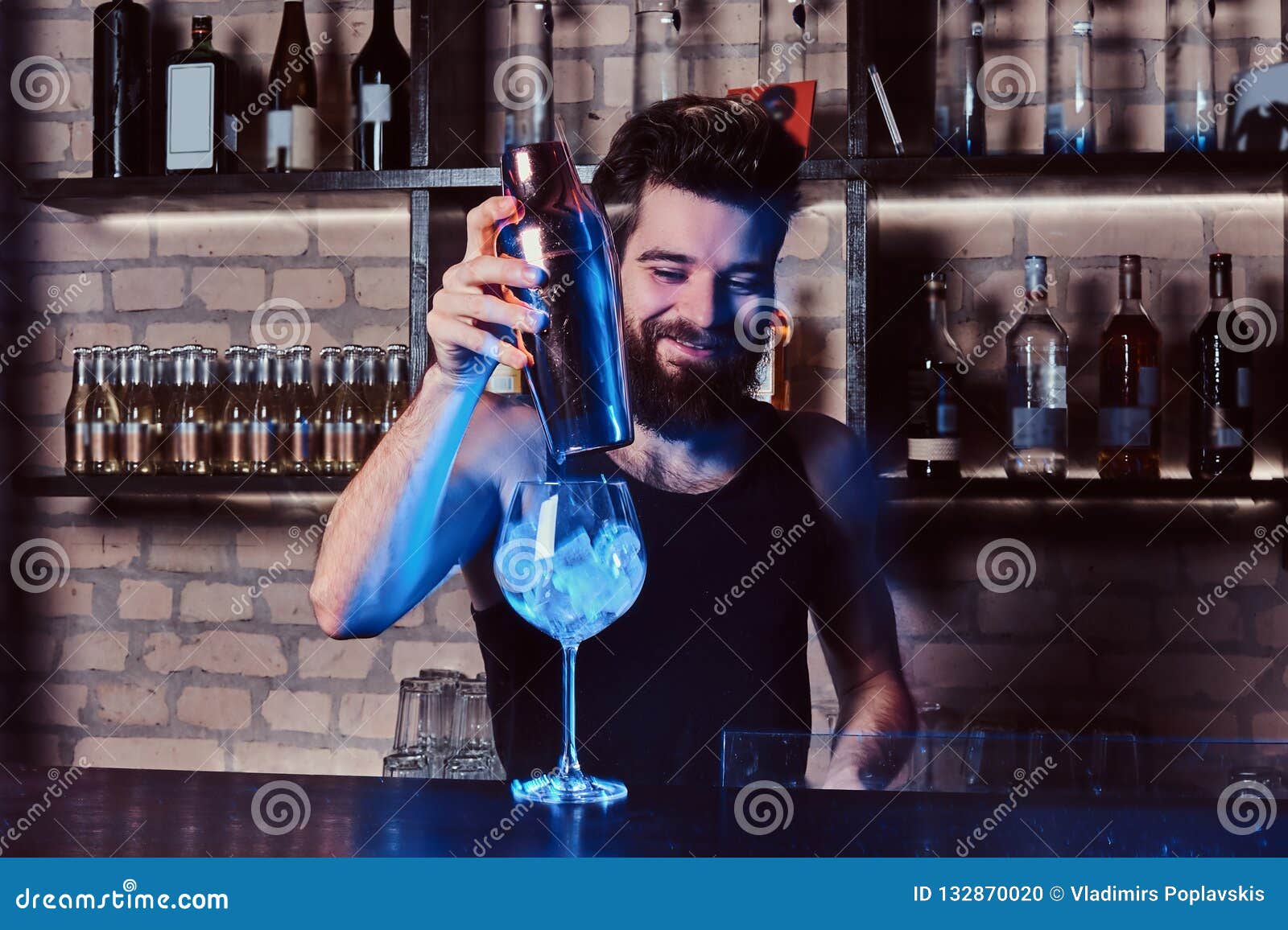 A Bartender Working Behind the Bar Counter Stock Photo Image of