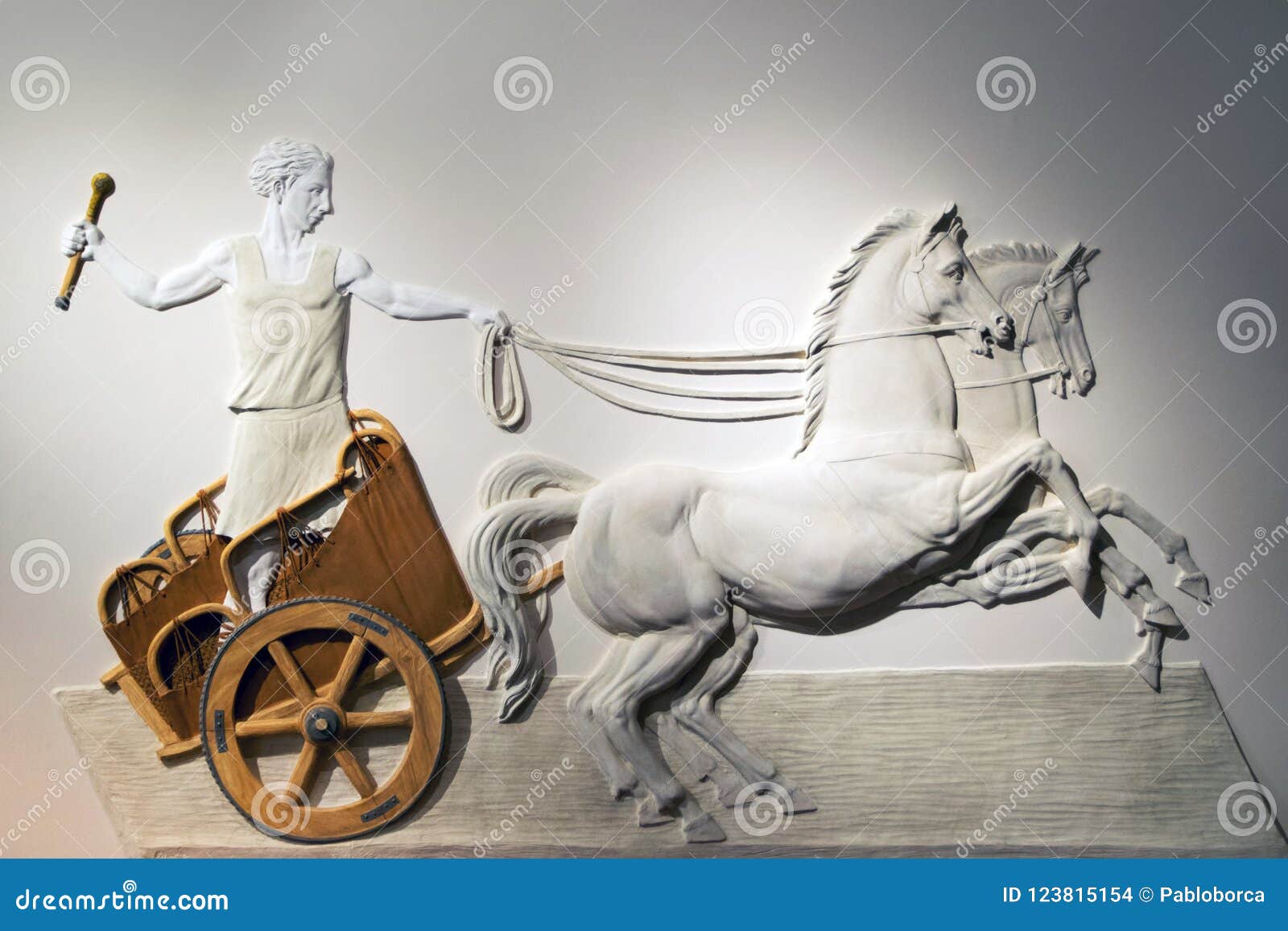 bas-relief of a roman centurion driving a chariot