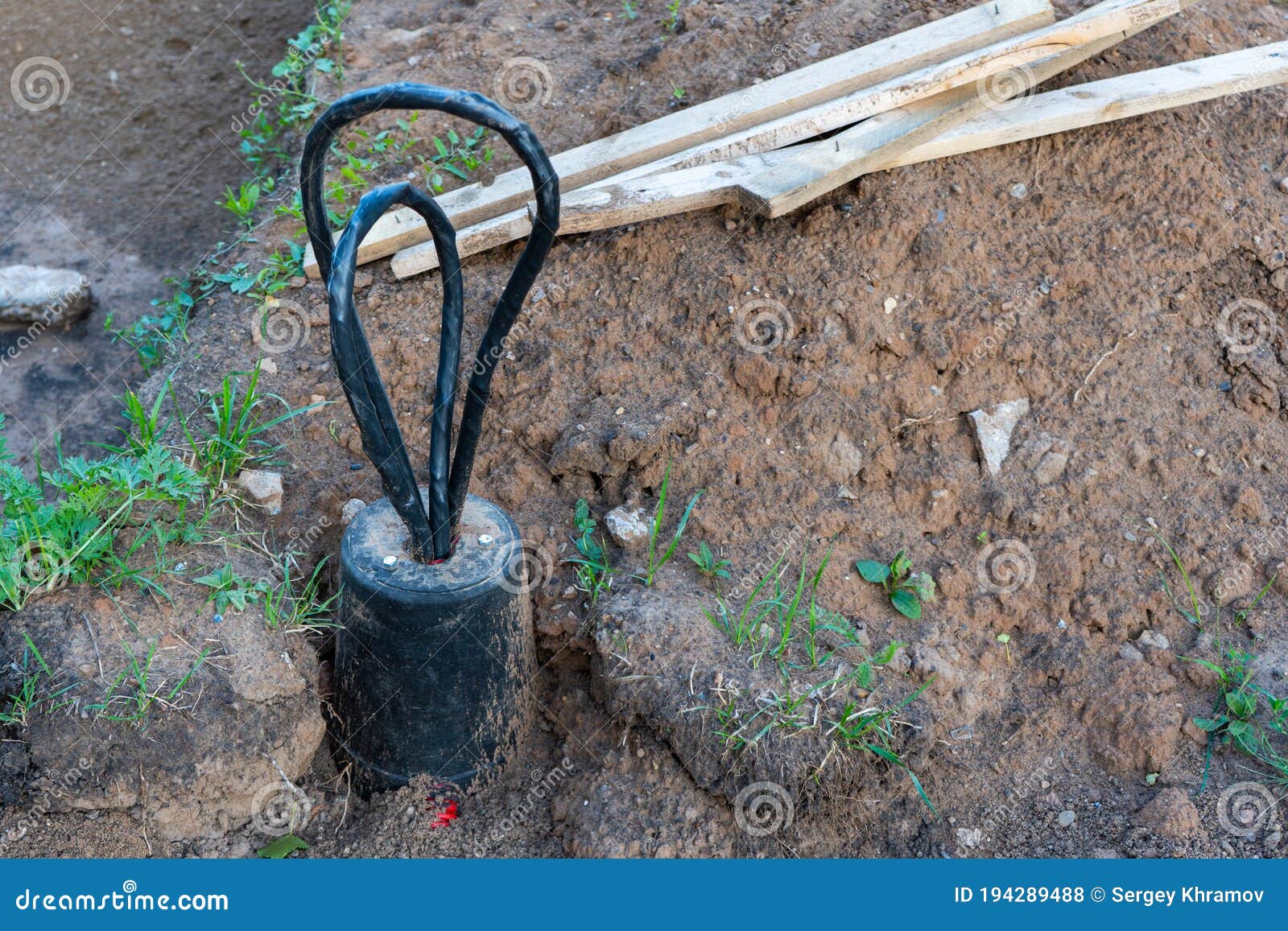 Cable Sticking Out Of Cement Dirty Floor Background Wiring Repair