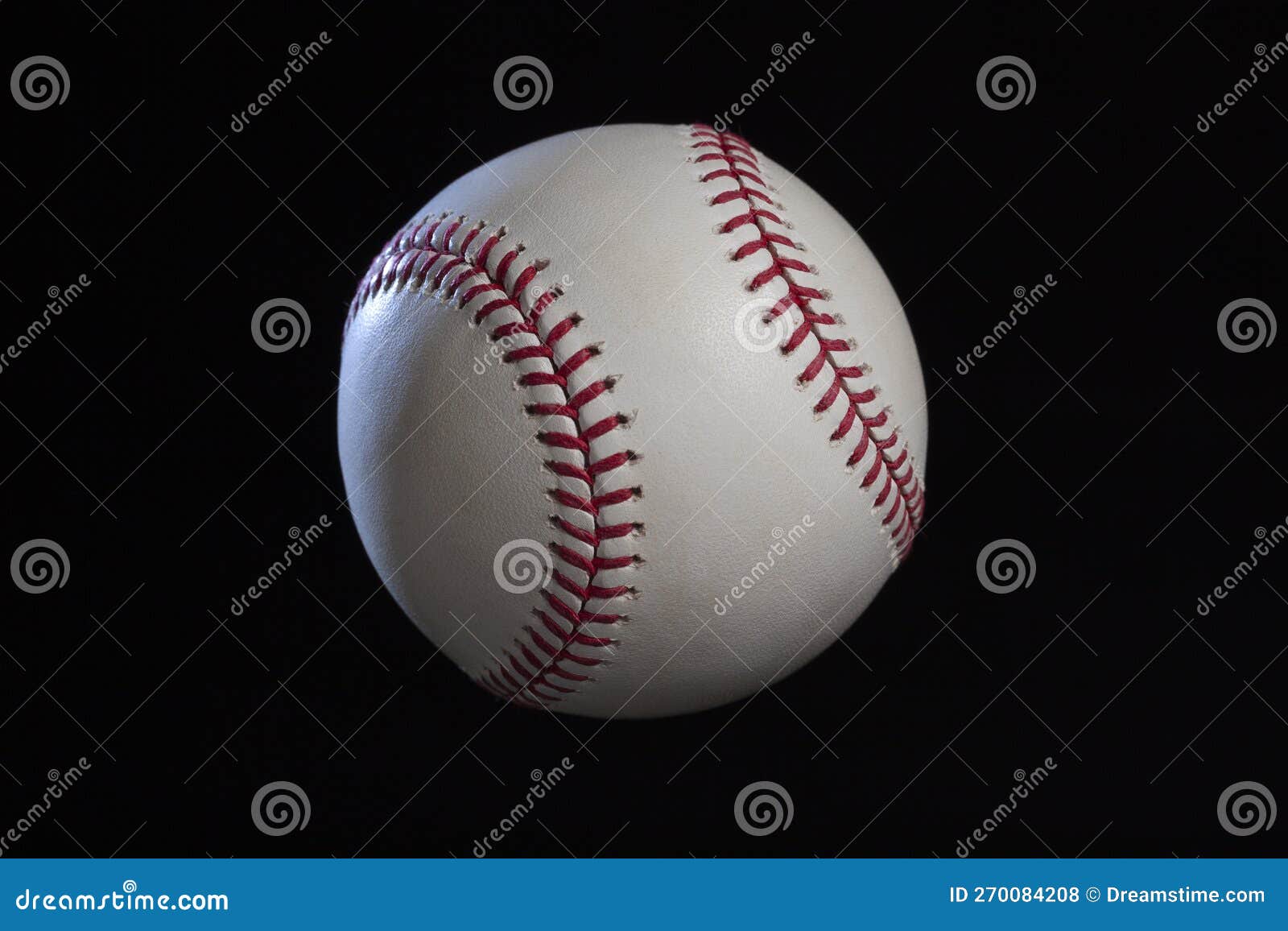 Baseball with Dramatic Lighting Isolated on a Black Background Stock