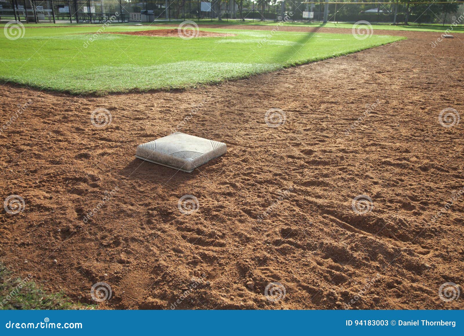 baseball field infield with first base in the foreground