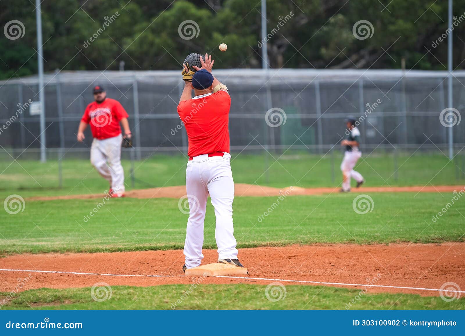 Baseball Game, First Baseman Catching the Ball Thrown from the Infielder during the Ball Game