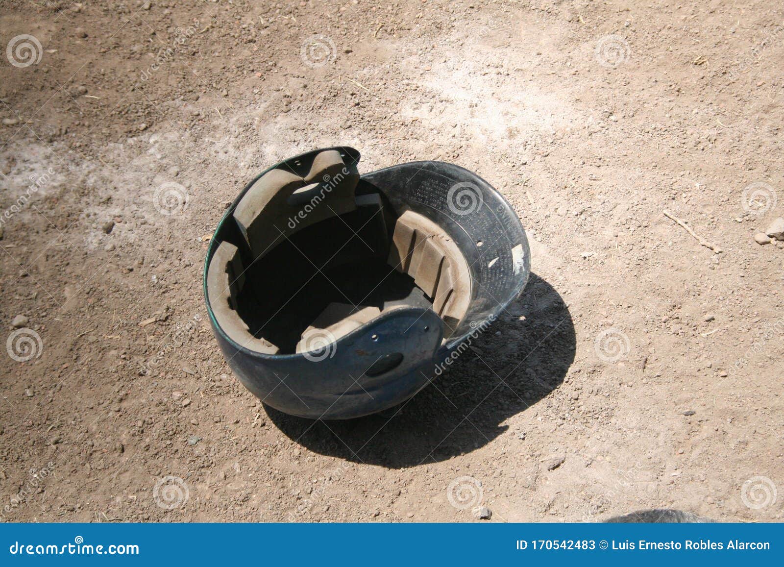 baseball helmet lying on the ground floor