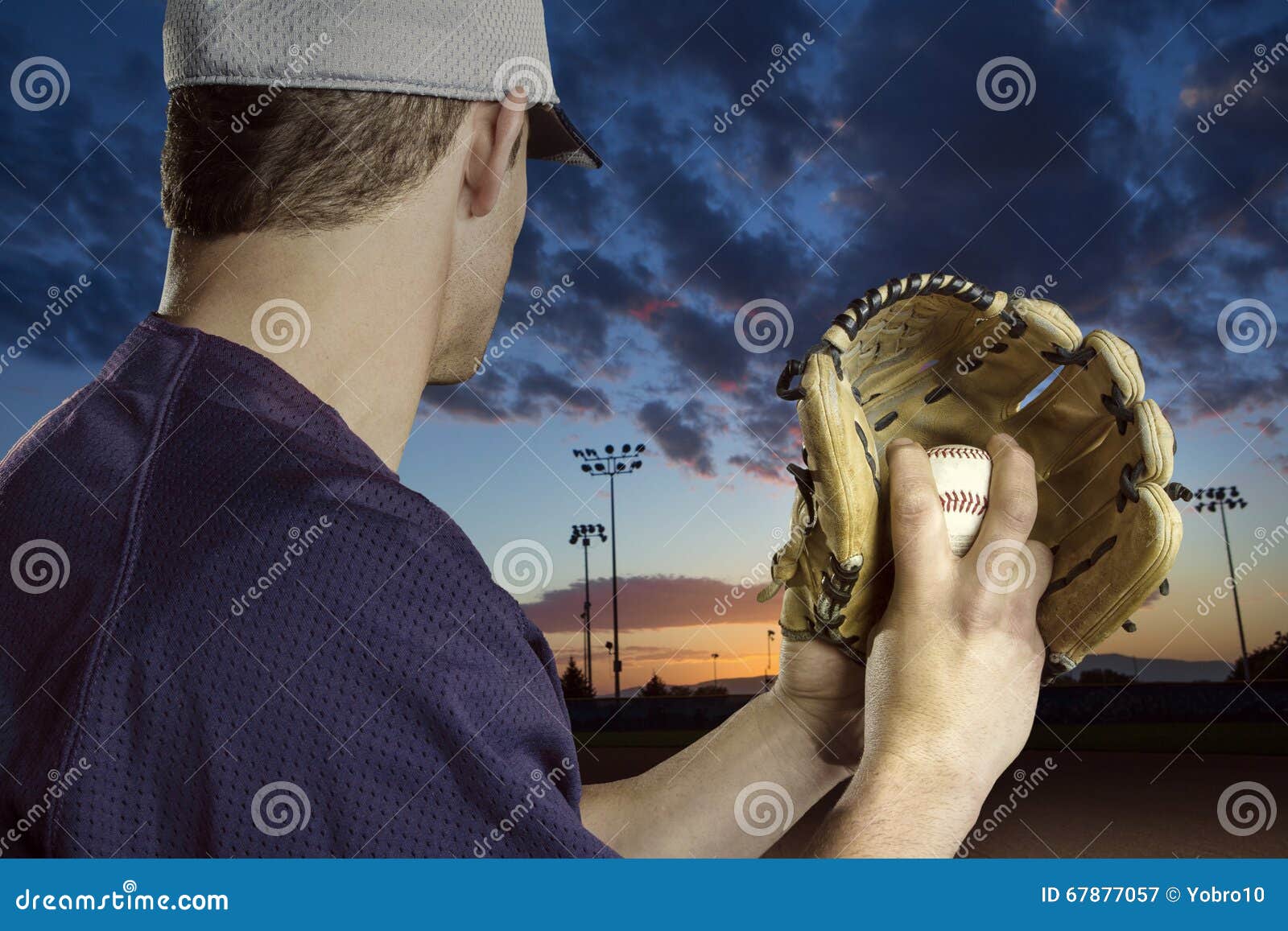 Baseball Pitcher Ready To Pitch in an Evening Baseball Game Stock Image