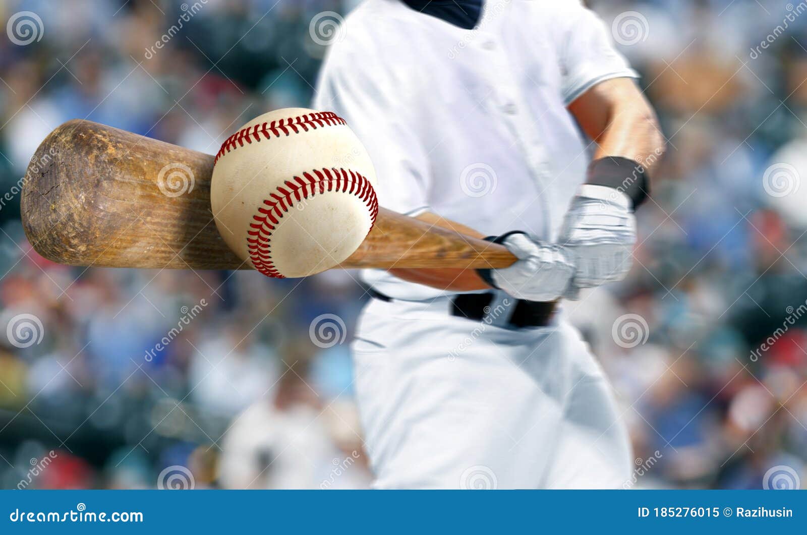 baseball player hitting ball with bat in close up