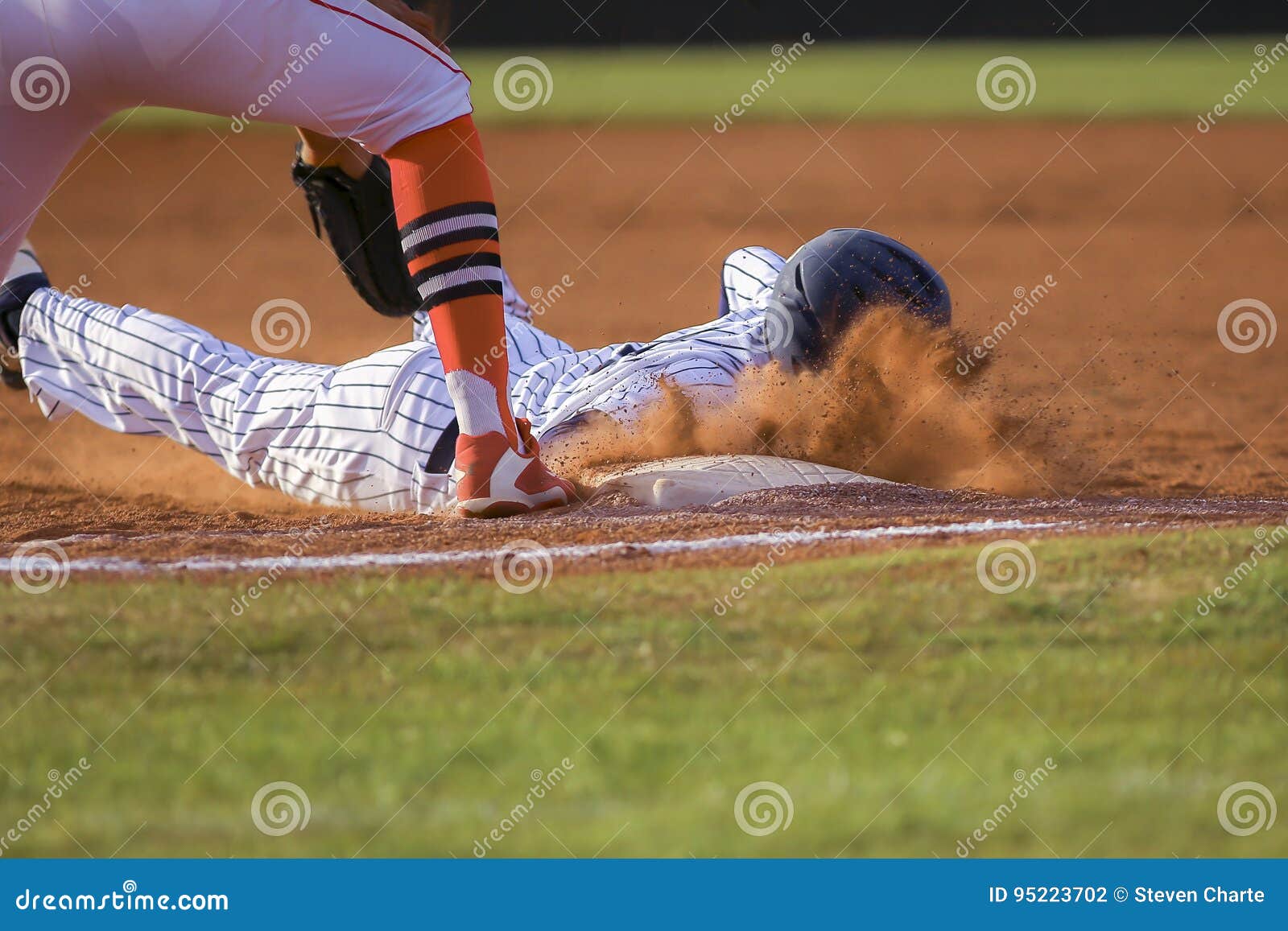 baseball player sliding first base