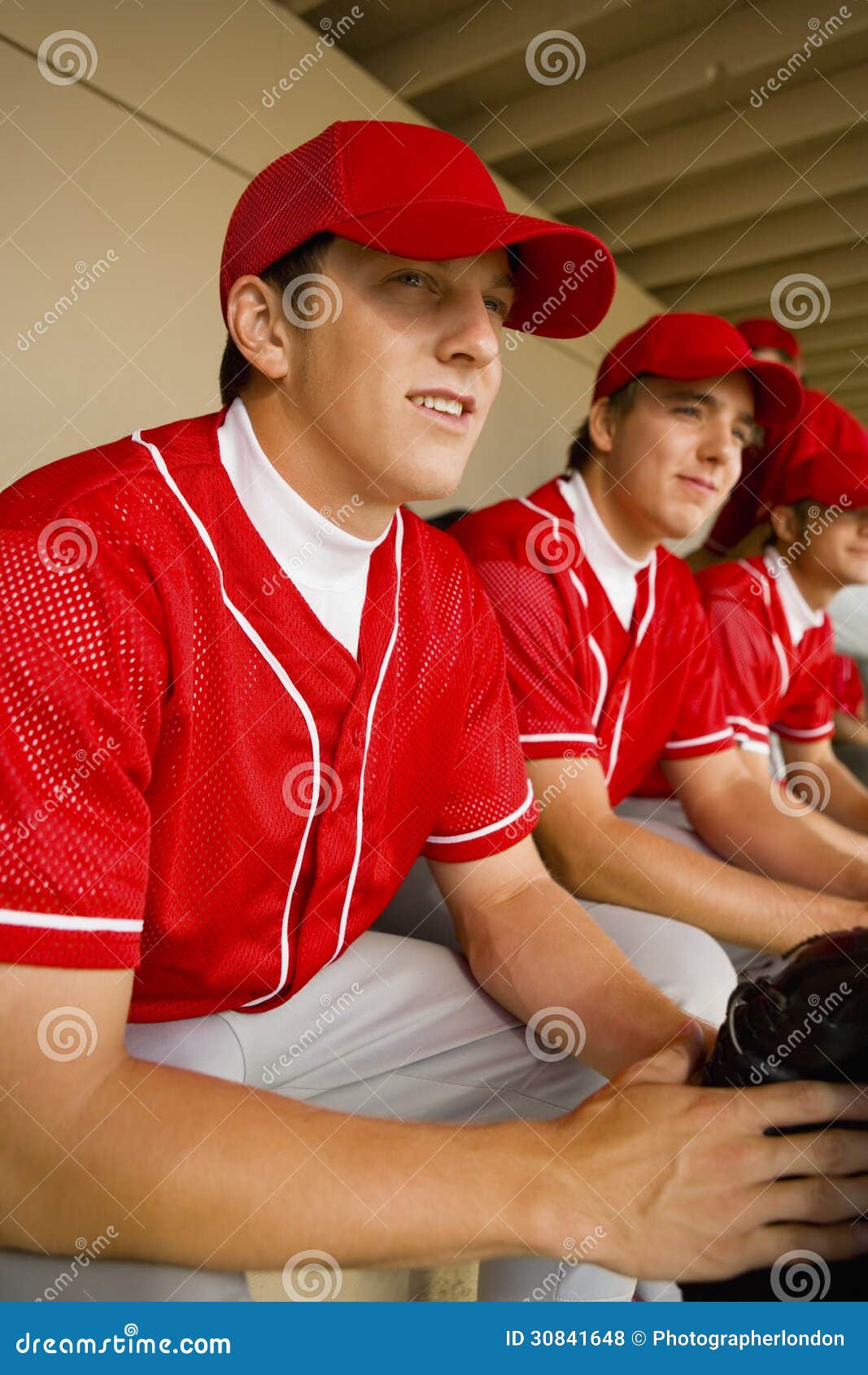 Baseball Team Mates Sitting in Dugout Stock Photo Image of looking