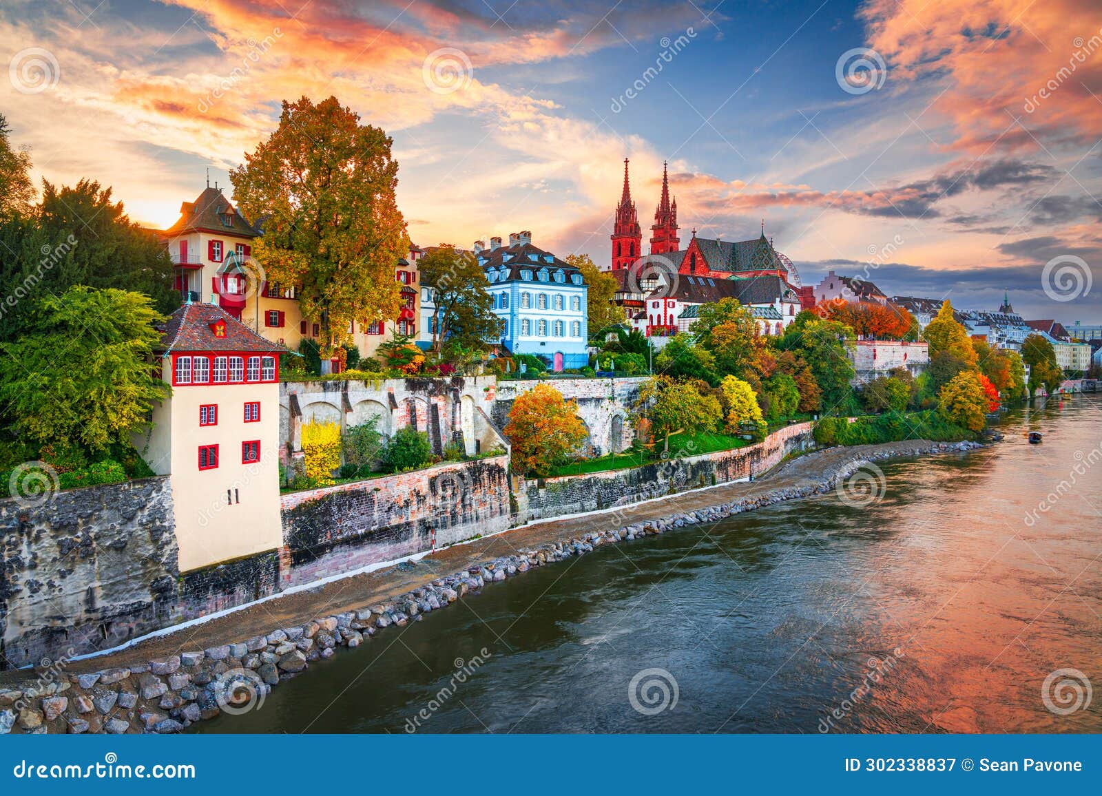 basel, switzerland on the rhine river at dusk in autumn