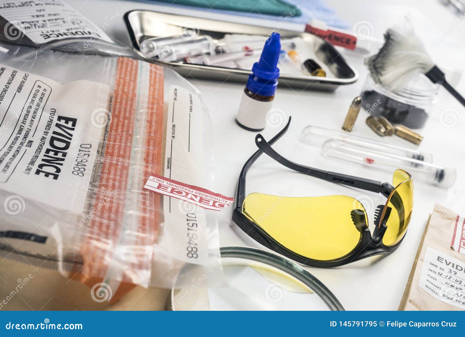 basic research utensils with a evidence bag in laboratorio forensic equipment