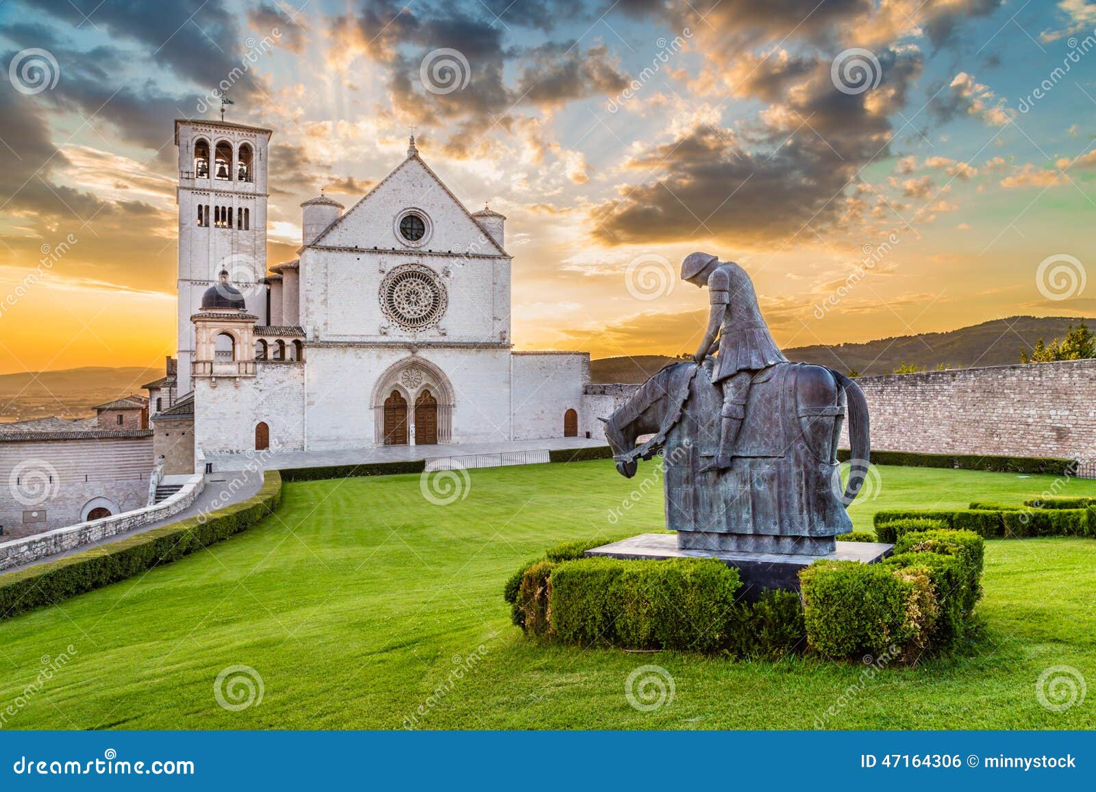 basilica of st. francis of assisi at sunset, umbria, italy