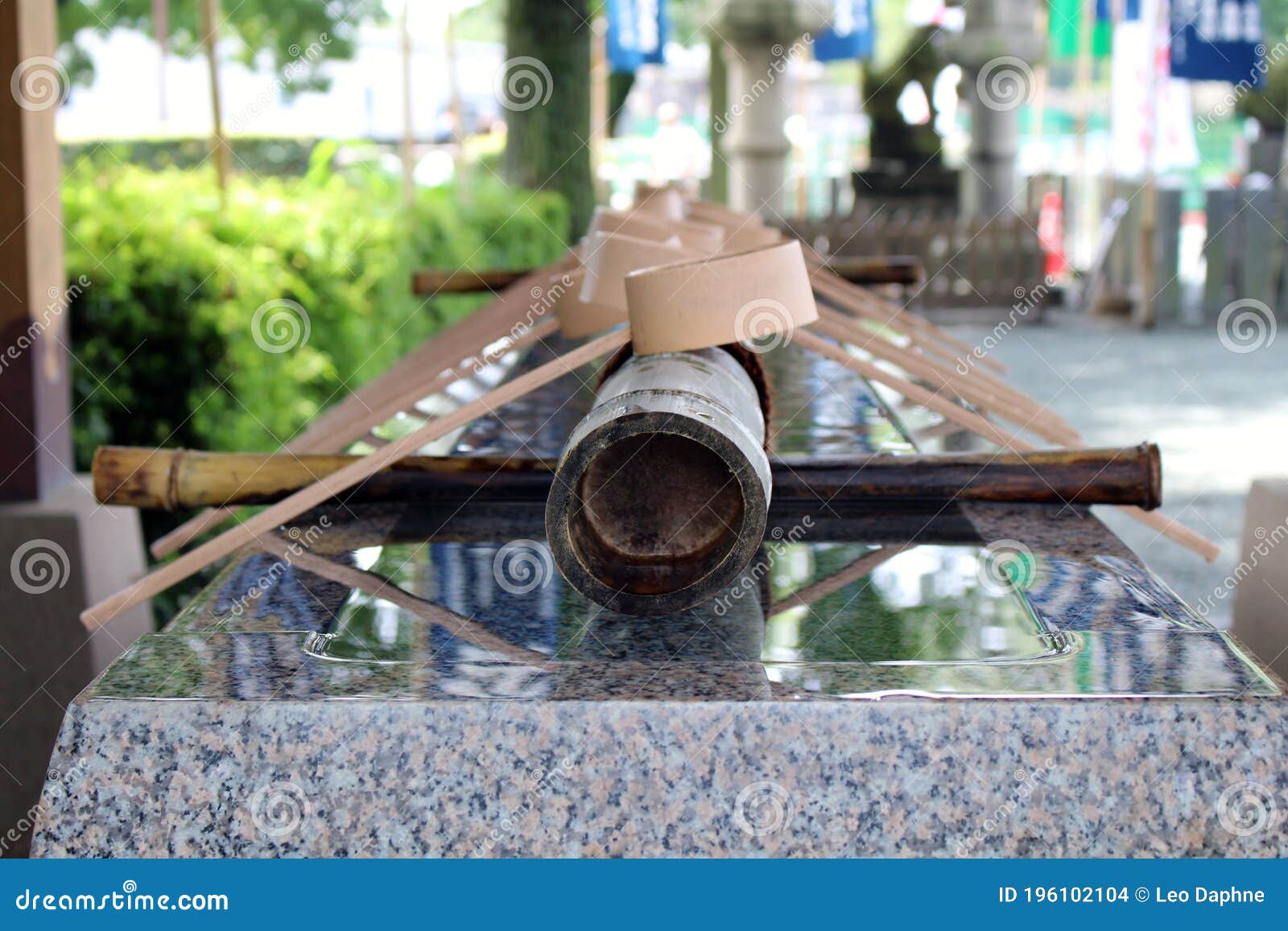 the basin or chozubachi and dippers used in ritual entering shinto shrine at kato jinja kumamoto