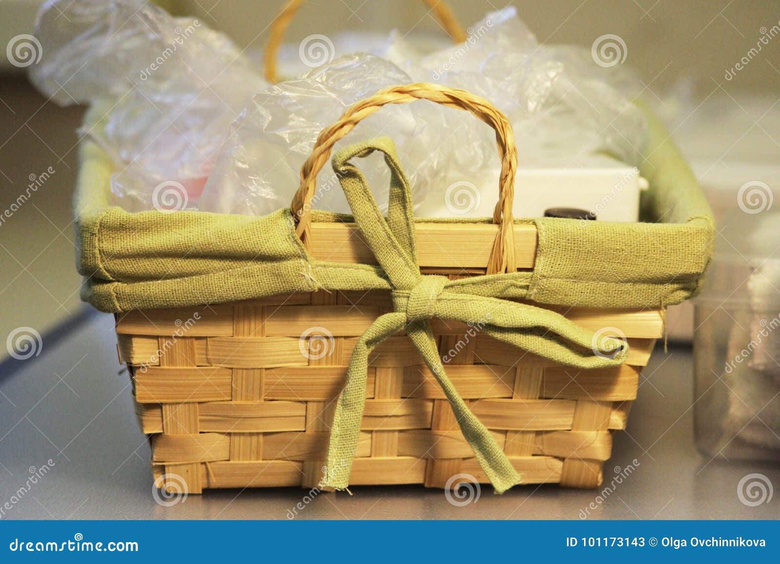 A Basket with Accessories for Applying Manicure and Bottles with a