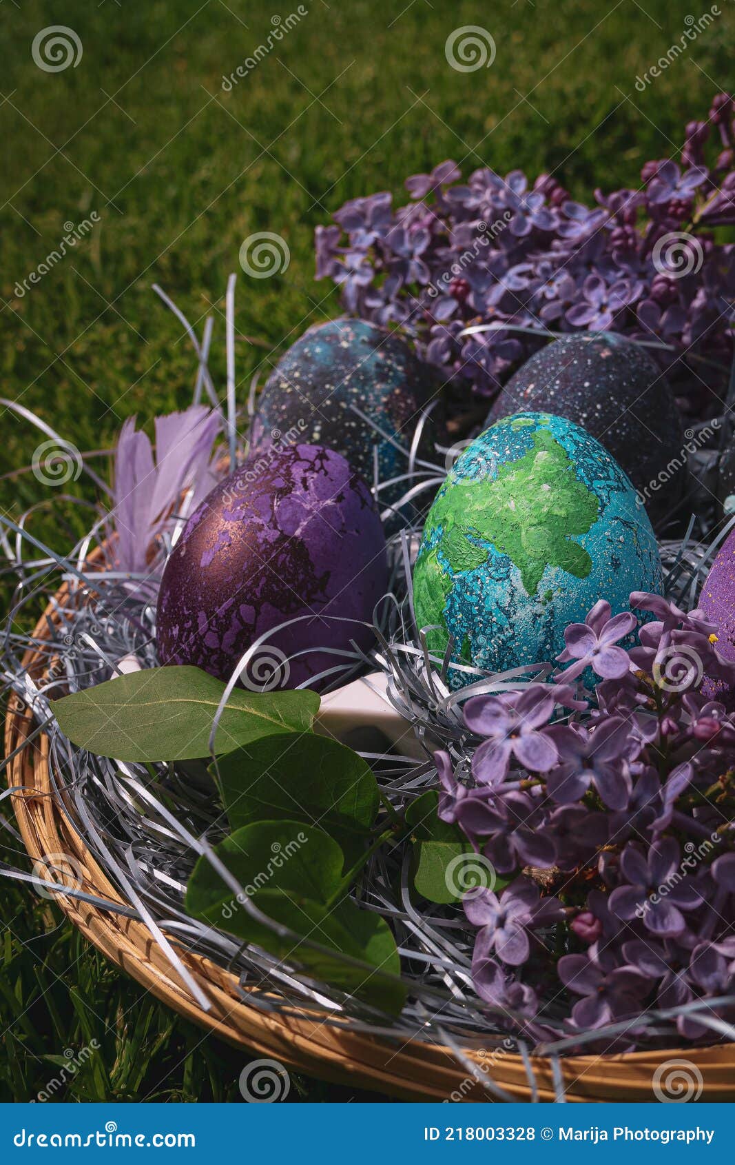Basket with Easter Decorations, Easter Eggs and Lilacs. Easter Concept