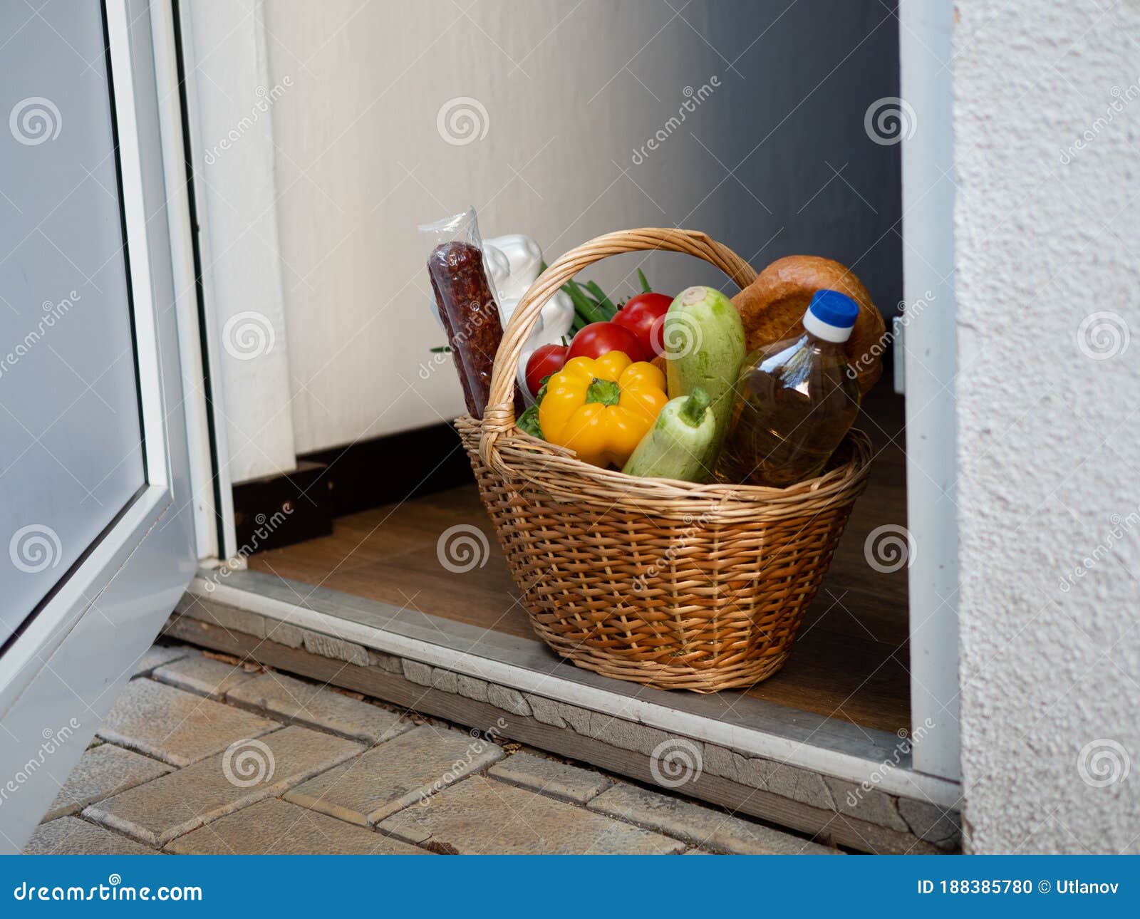 Baby In A Basket On A Doorstep Stock Photo, Picture and Royalty Free Image.  Image 15440807.