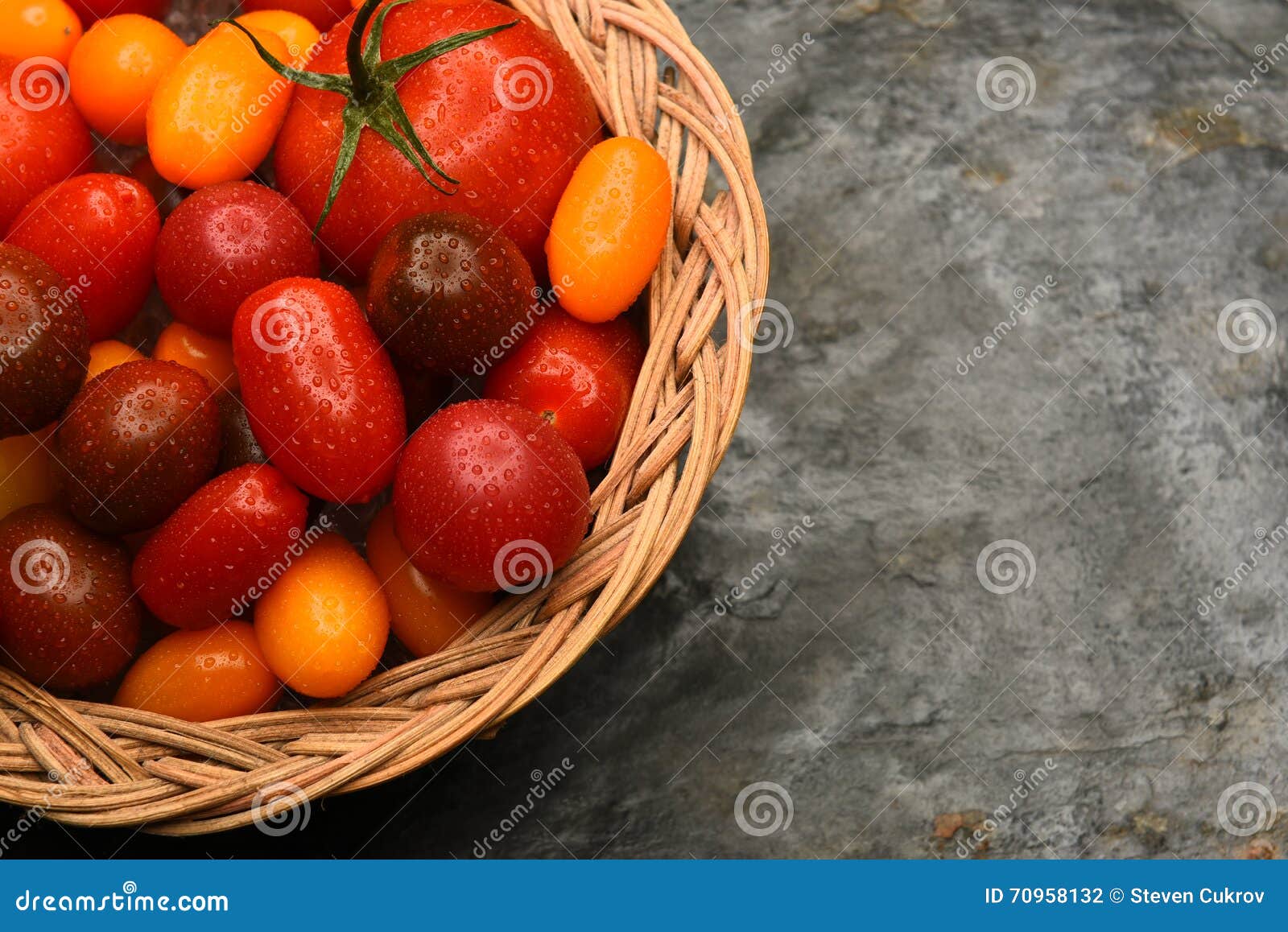 Basket of Medley Tomatoes stock photo. Image of misted 70958132
