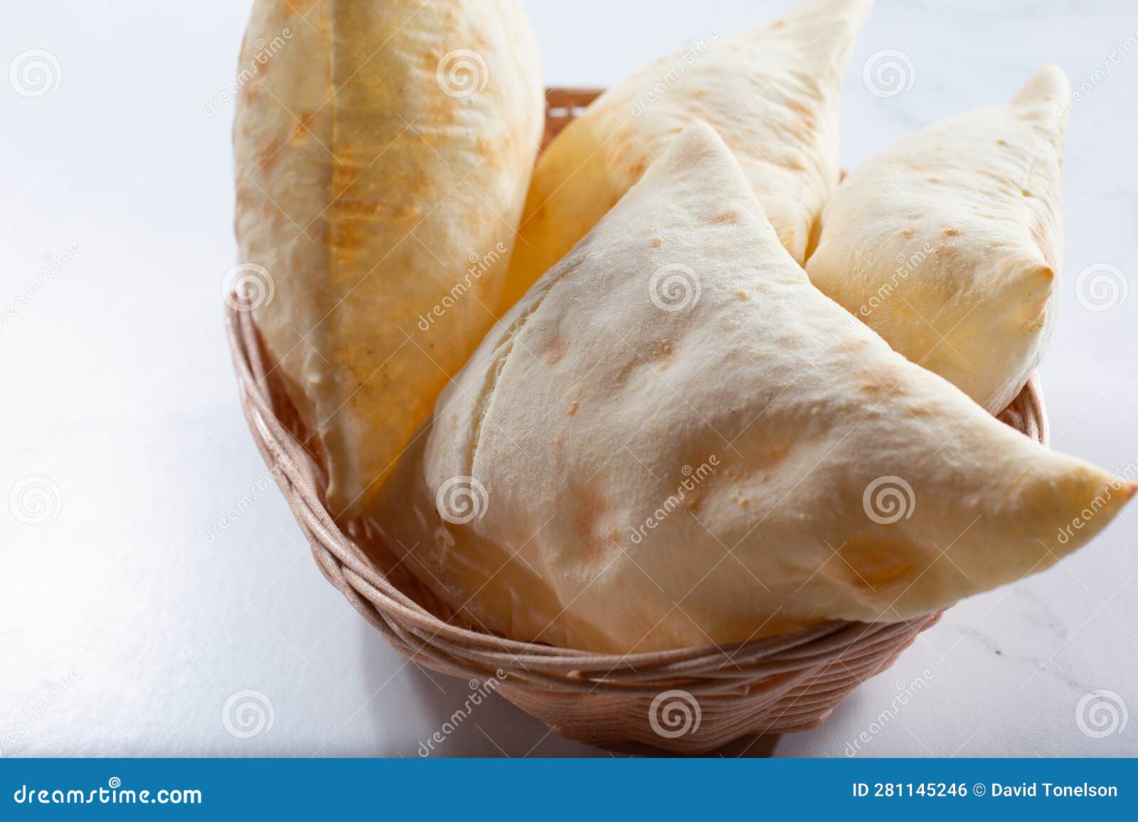 Basket of pita bread stock photo. Image of merchandise 281145246
