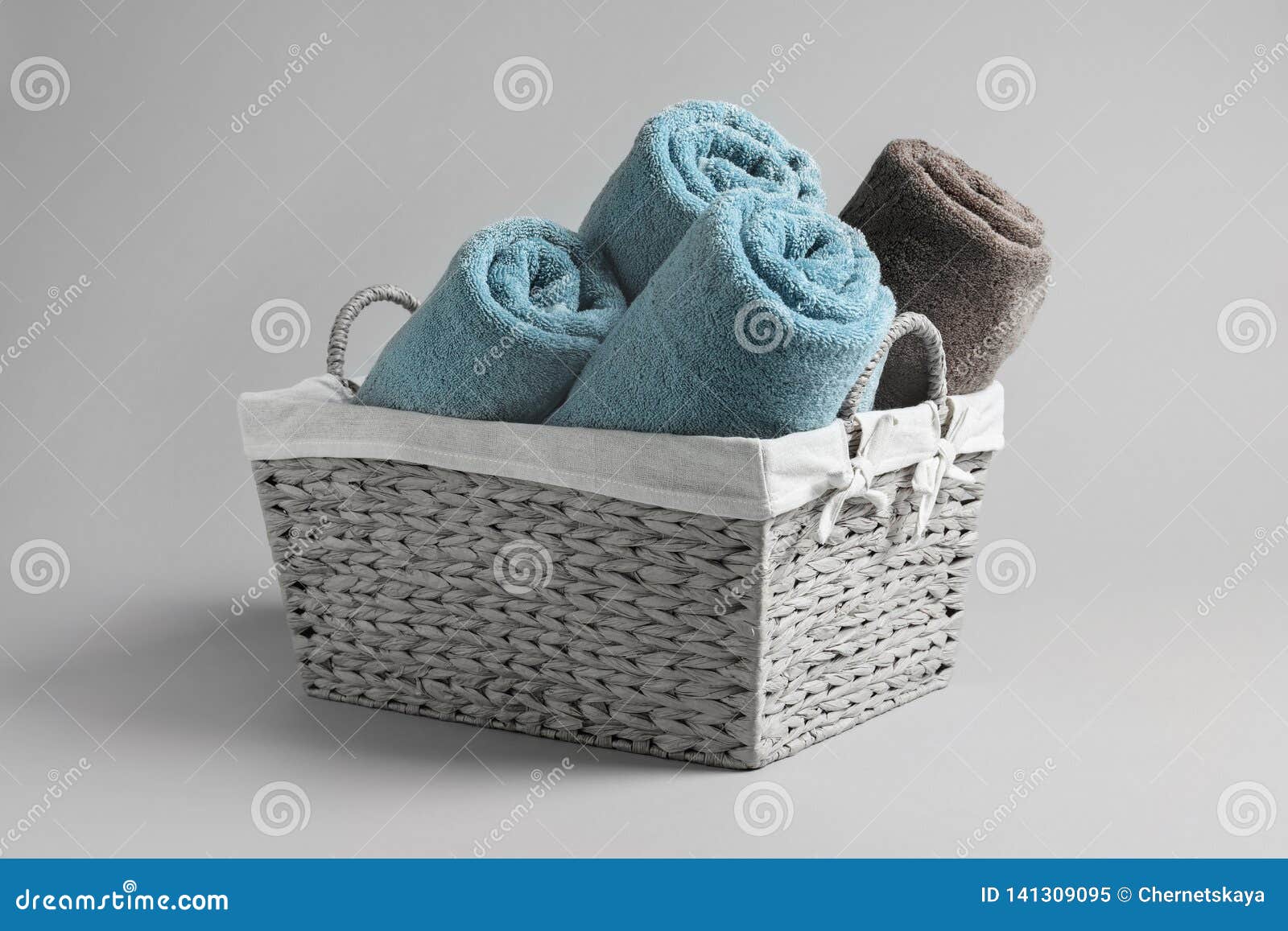 Basket with rolled towels stock image. Image of hygiene 141309095