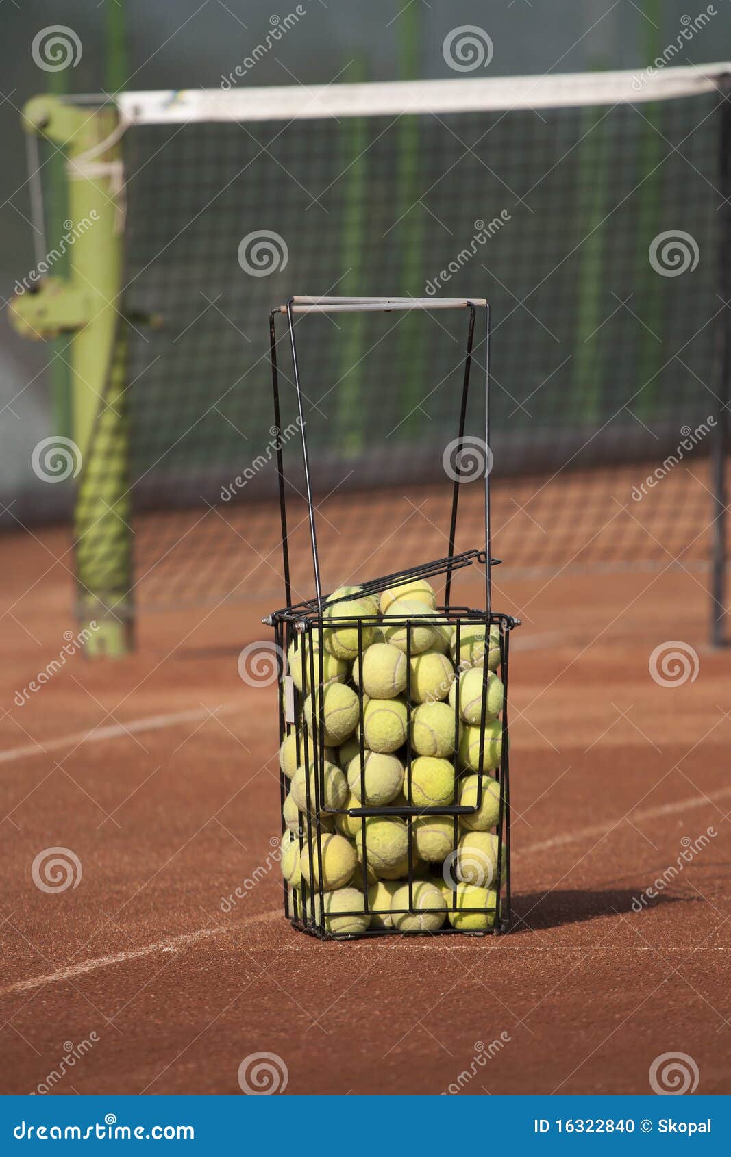 Basket with tennis balls stock photo. Image of yellow 16322840