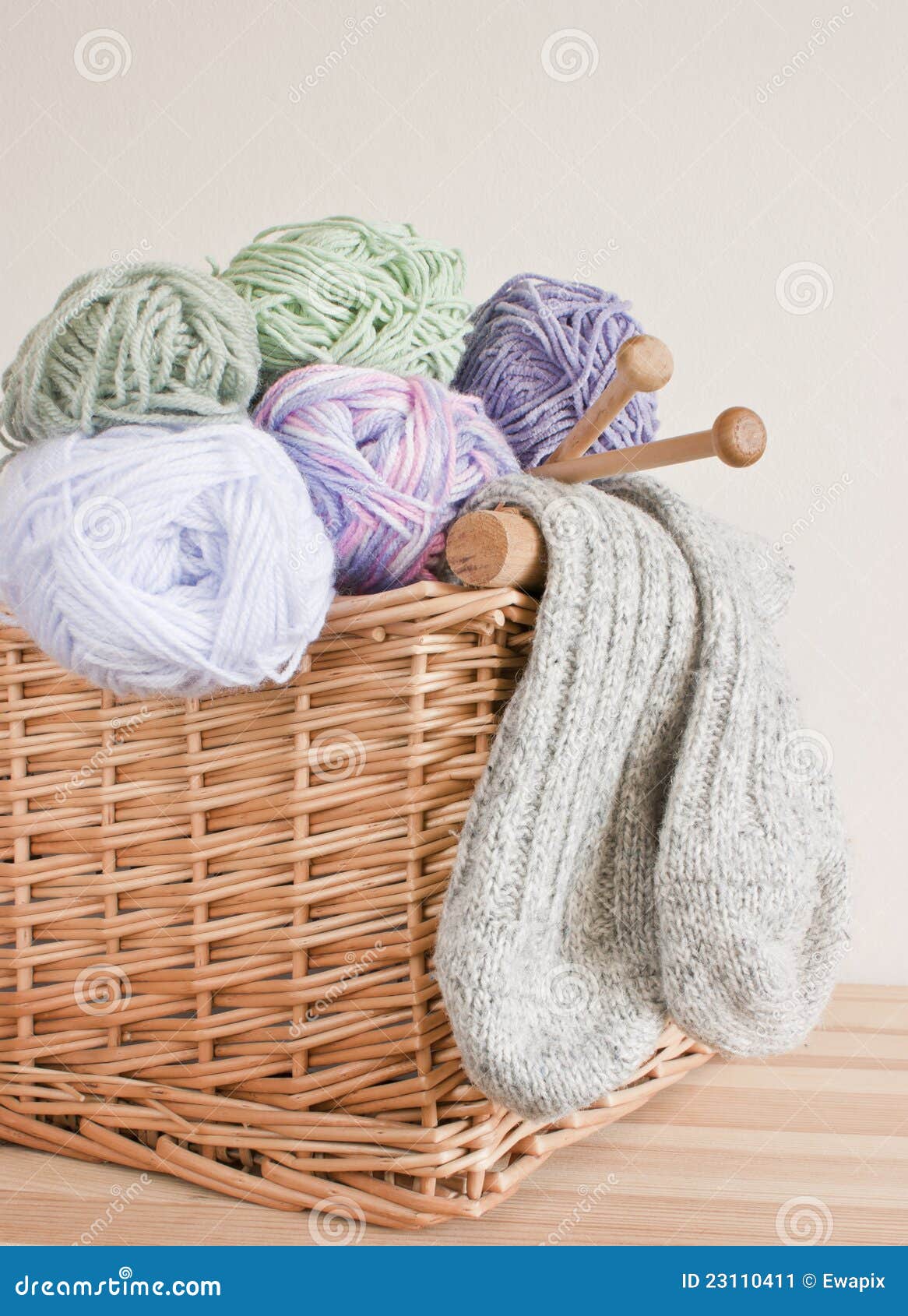 Basket With Wool, Knitting Needles And Socks. Stock Image - Image: 23110411