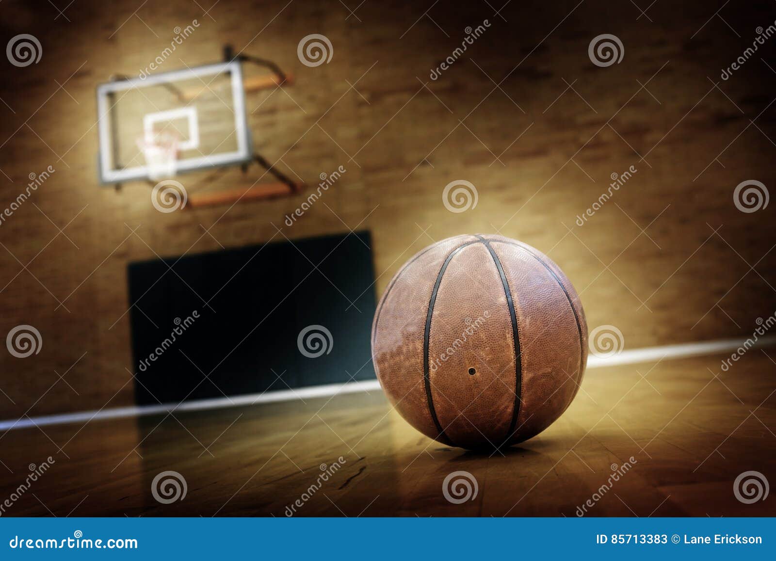 Man Playing a Ball on the Basketball Court · Free Stock Photo