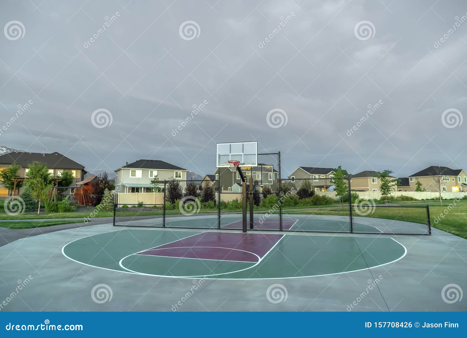 Basketball Cout in the Middle of a Neighborhood with an Overcast Sky  Overhead Stock Photo - Image of clouds, cloudy: 157708426