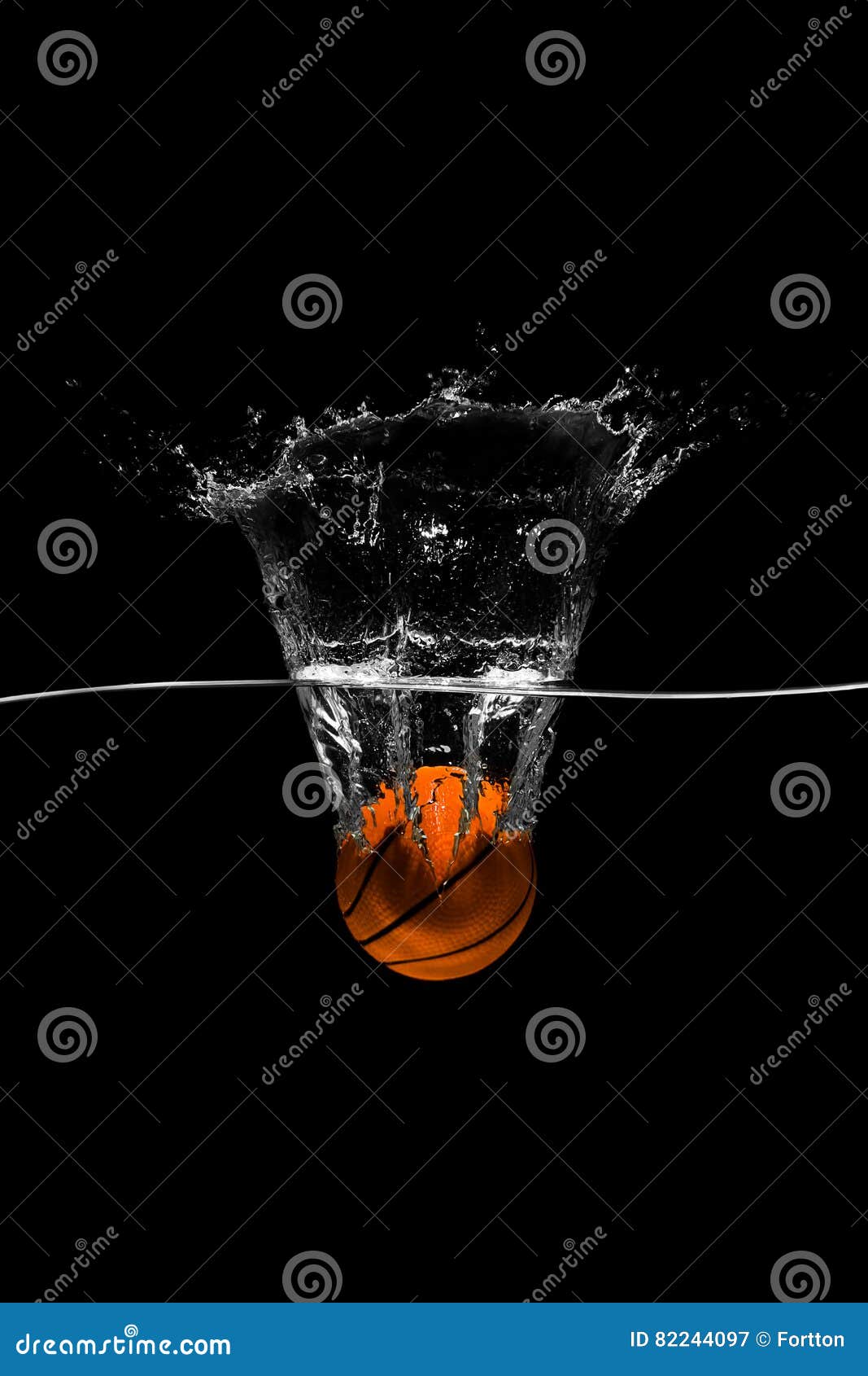 Basketball Falls into the Water on Black Background Stock Image Image