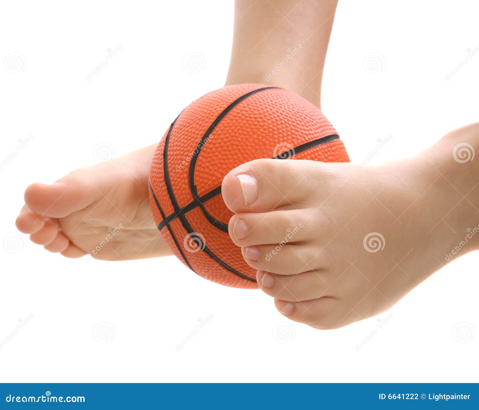 Basketball between feet stock photo. Image of balanced 6641222